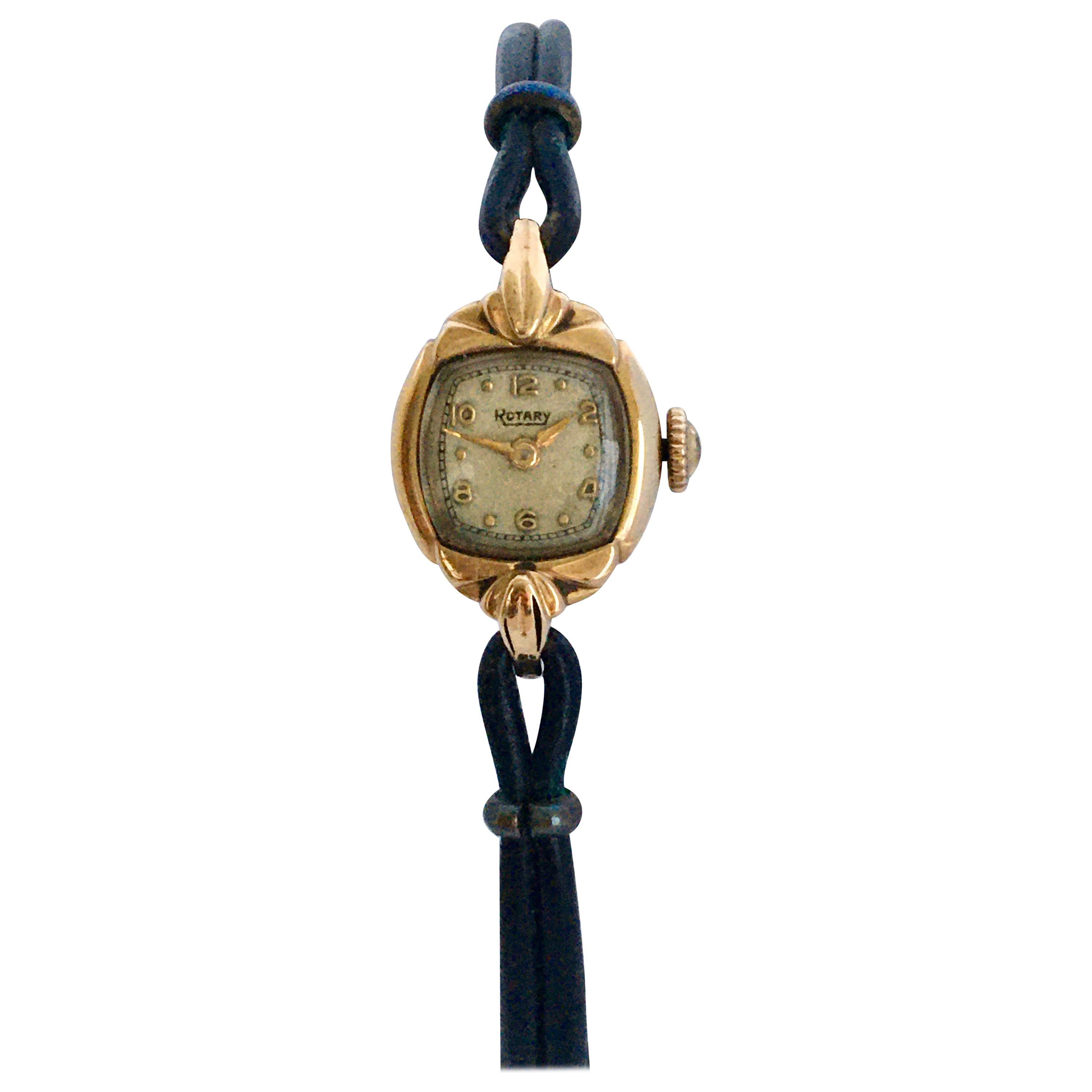 This beautiful petite vintage mechanical gold watch is in good working condition and it keeps a good time. Visible signs of ageing and wear as shown. The black leather knitted strap is a bit worn but still wearable. 

Please study the images