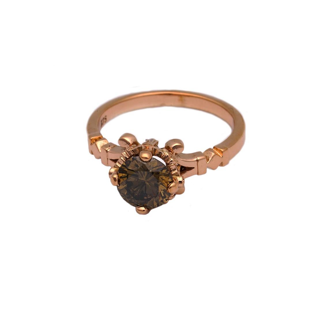 This 9kt rose gold ring is a feminine delight. 

Handmade in 9kt rose gold this stunning ring features a 4 claw set, round, brilliant cut, 0.90ct diamond, SI in clarity and deep cognac in colour. 

This breathtaking diamond is set in a signature