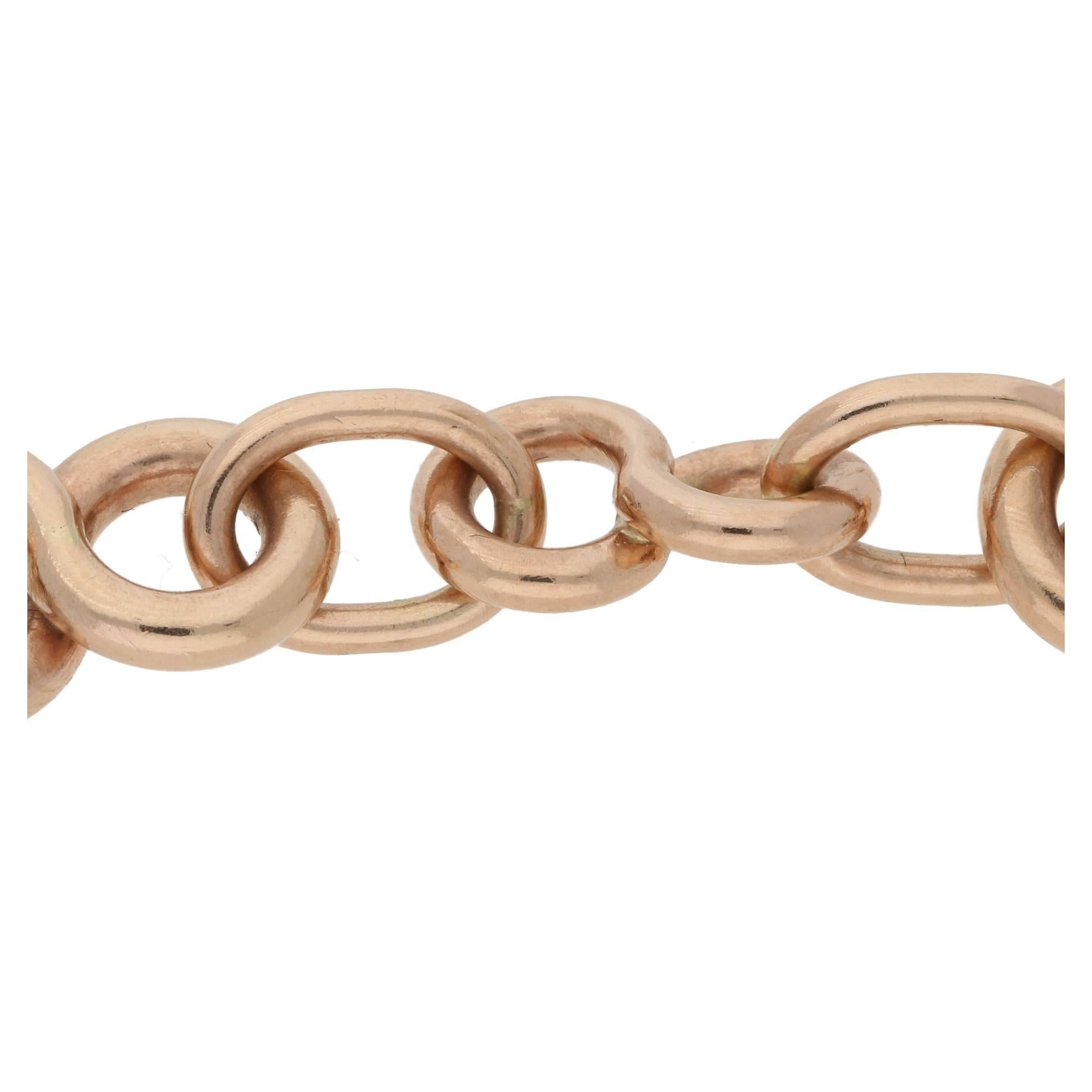 A fun warm rose gold tone 9k gold bracelet. The bracelet is formed of figure of eight motifs each linked with an oval section. This measures 7.5 inches length, the clasp is hallmarked 9k indicating the gold quality.
