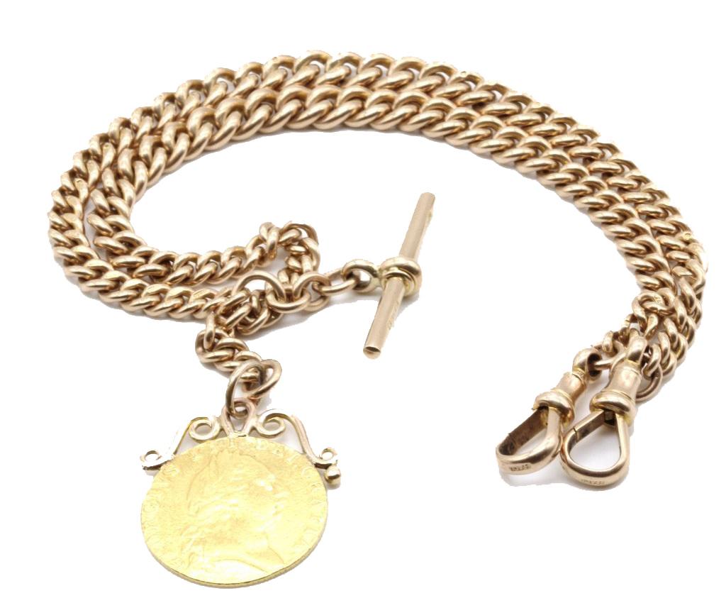 A 9 Kt Rose gold Double Albert Gentleman's pocket watch chain with an 18 Kt gold George III 1788 spade guinea pendant fob.
The double graduated curb link chain hallmarked on all the links, T bar and swivel clasps.
Hallmarked Birmingham UK 1922
Maker