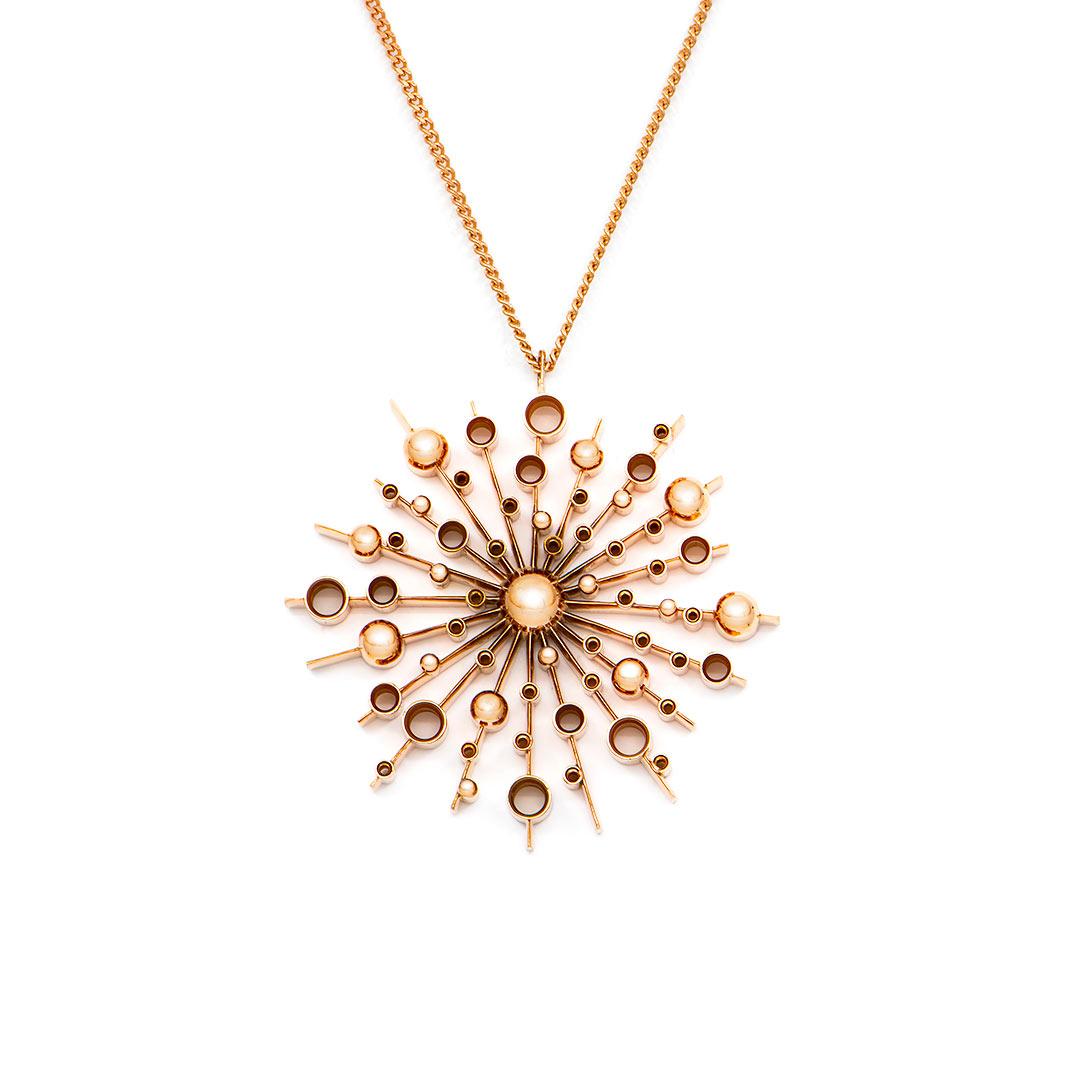 Part of the 'Soleil' collection by Natalie Barney, this pendant necklace features a 40mm wide sunburst with smaller sunbursts on the chain. This pendant comes complete with a 45cm fine trace chain.

Made in 9 carat rose gold.  Please request the