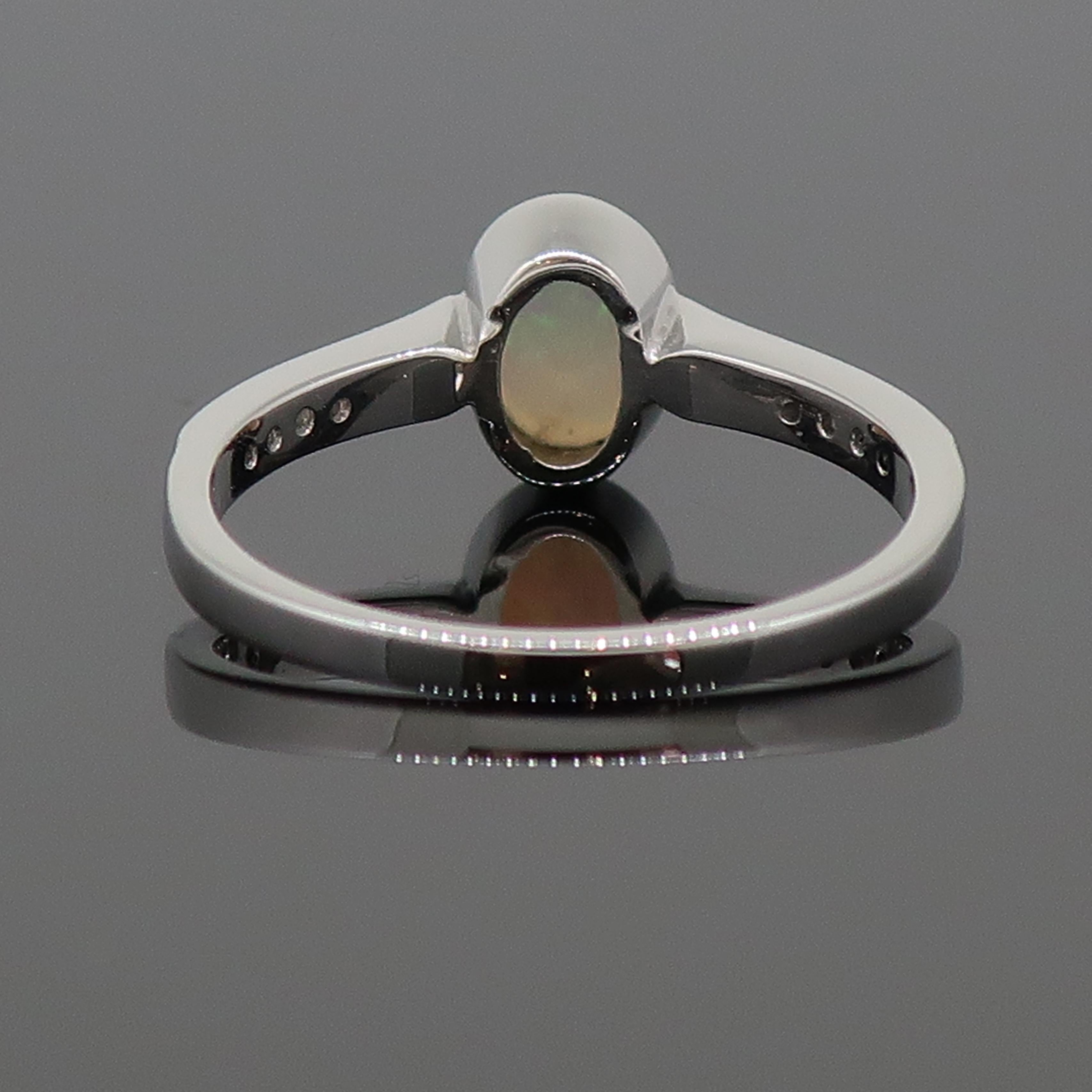 Oval Cut 9 Karat White Gold Oval Opal Solitaire Ring with Diamond Shoulders For Sale