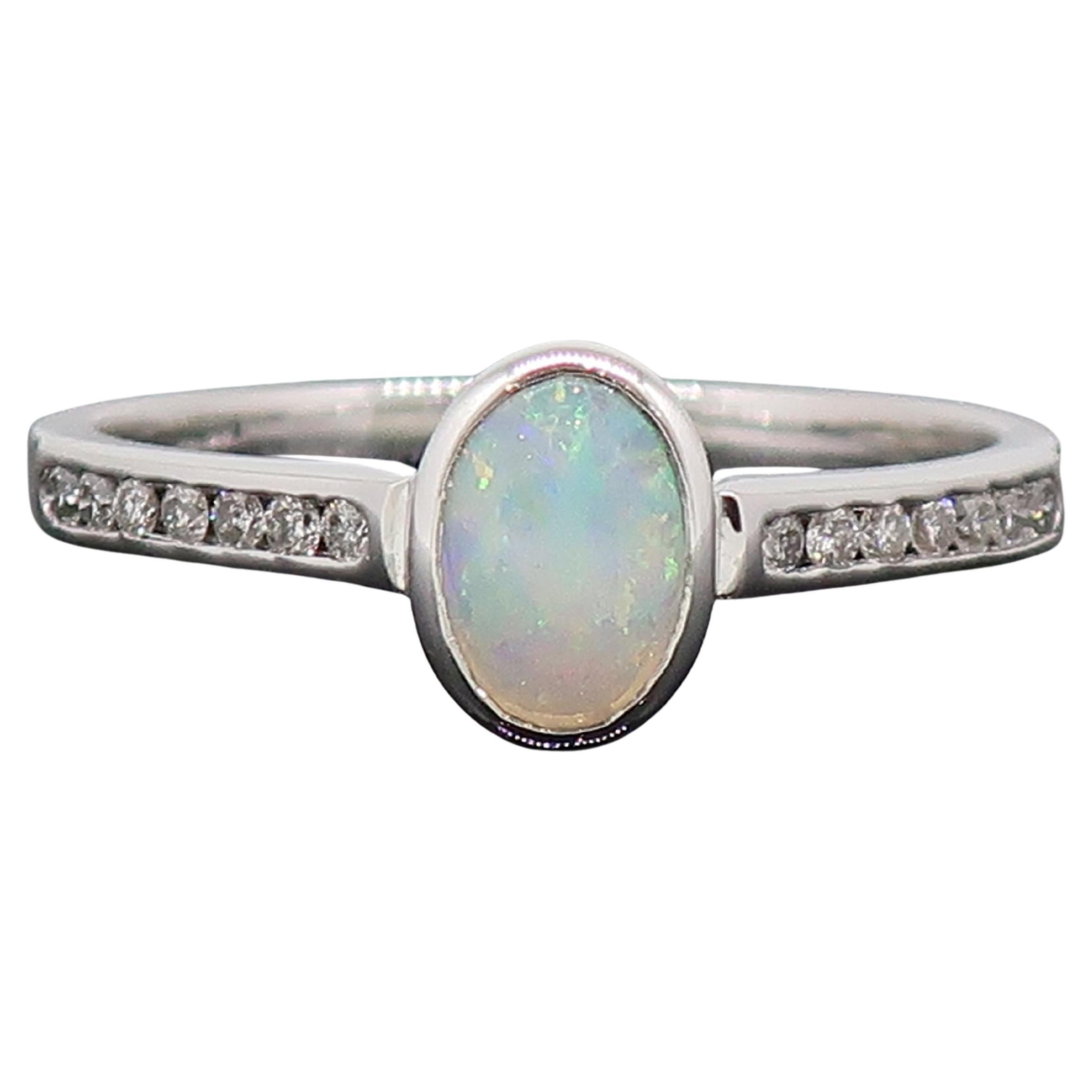 9 Karat White Gold Oval Opal Solitaire Ring with Diamond Shoulders For Sale