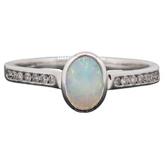 9 Karat White Gold Oval Opal Solitaire Ring with Diamond Shoulders