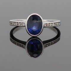 9 Karat White Gold Oval Sapphire Solitaire Ring with Diamond Shoulders