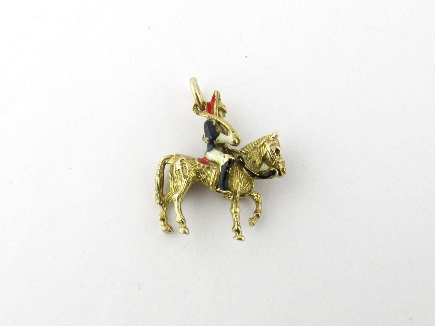 Vintage 9 Karat Yellow Gold and Enamel British Soldier on Horse Charm

This proud British soldier sitting on his stallion carries his saber over his shoulder. His traditional uniform is accented with black, white and red enamel. Some wear associated