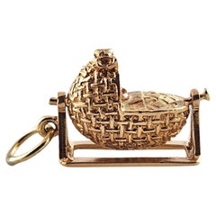 9 Karat Yellow Gold Baby in Swinging Woven Basket Charm #18791