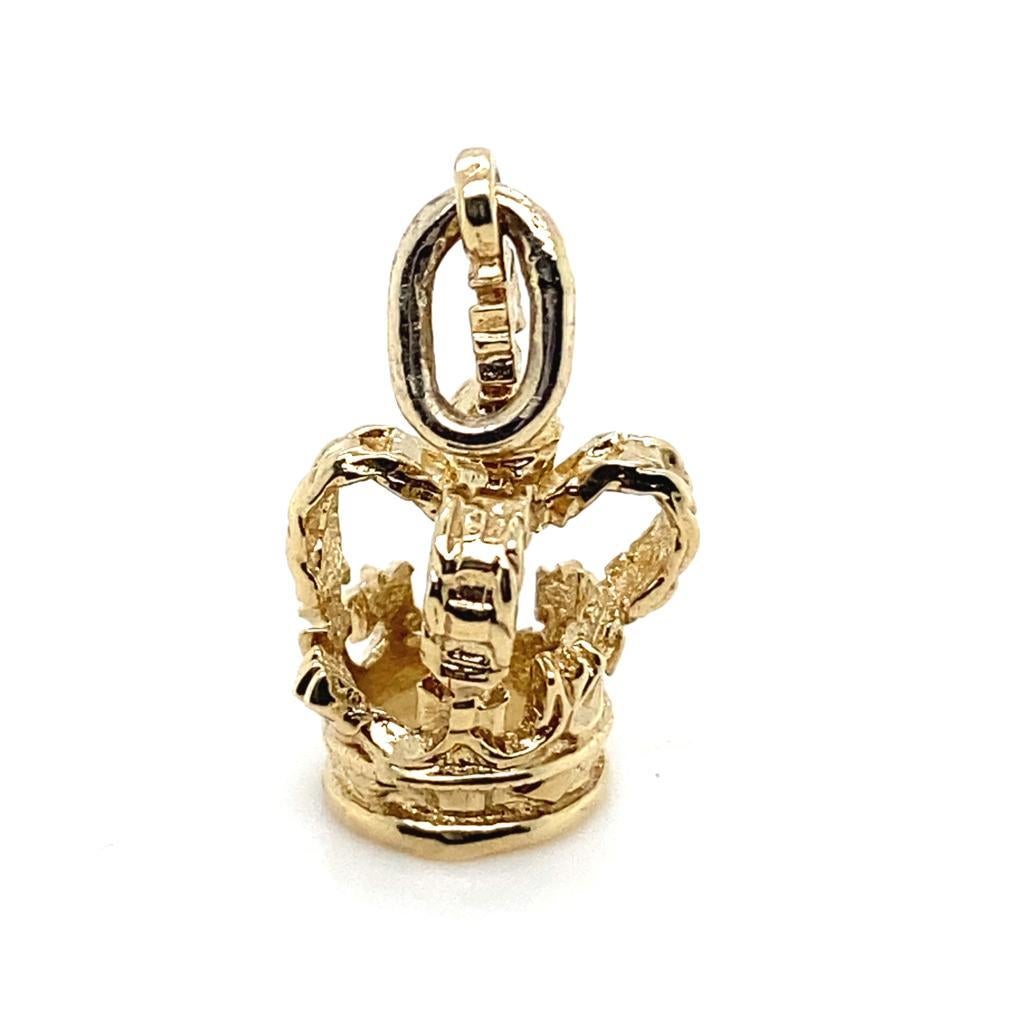 A 9 karat yellow gold crown charm.

Produced as a limited run by our workshop in celebration of the Coronation of King Charles III and all things British!

This charm is realistically modelled in 9 karat yellow gold and featuring a fully articulated