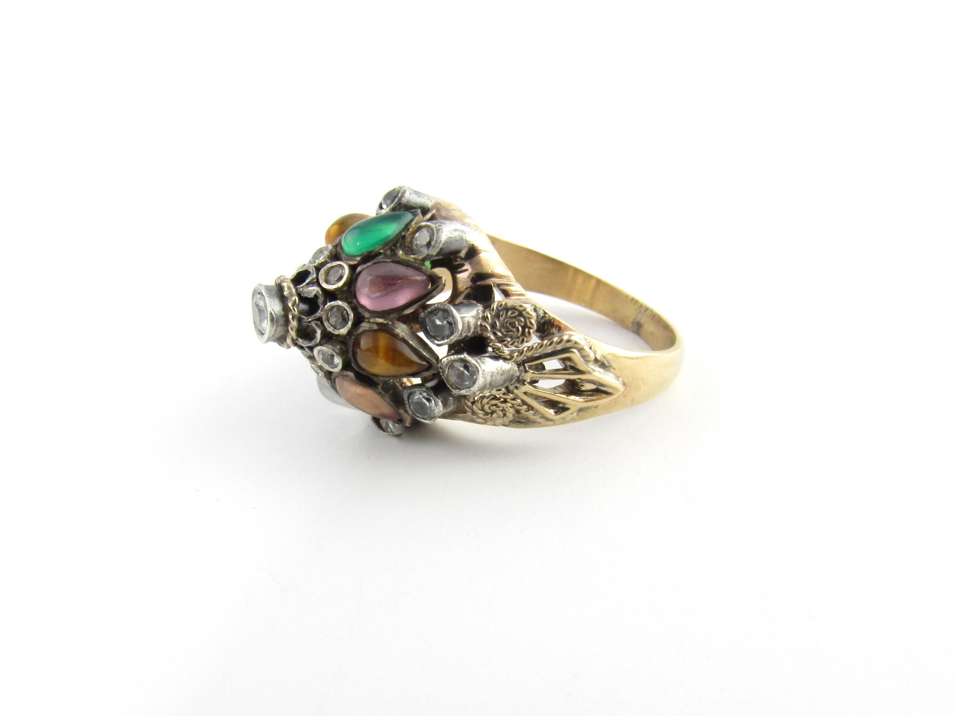 Vintage 9 Karat Yellow Gold Gemstone Harem Ring Size 6

This stunning ring features gemstones including crystal, garnet, jade, amethyst, citrine, moonstone and tiger's eye set in a lovely tiered harem setting. Height: 12 mm. Width: 14 mm. Shank: 2