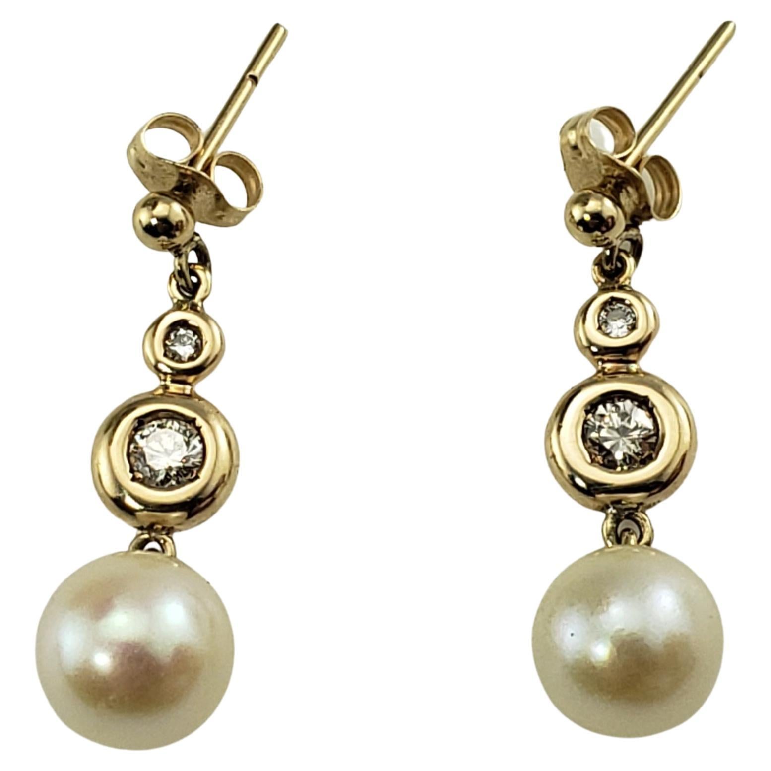 9 Karat Yellow Gold Pearl and Diamond Dangle Earrings For Sale