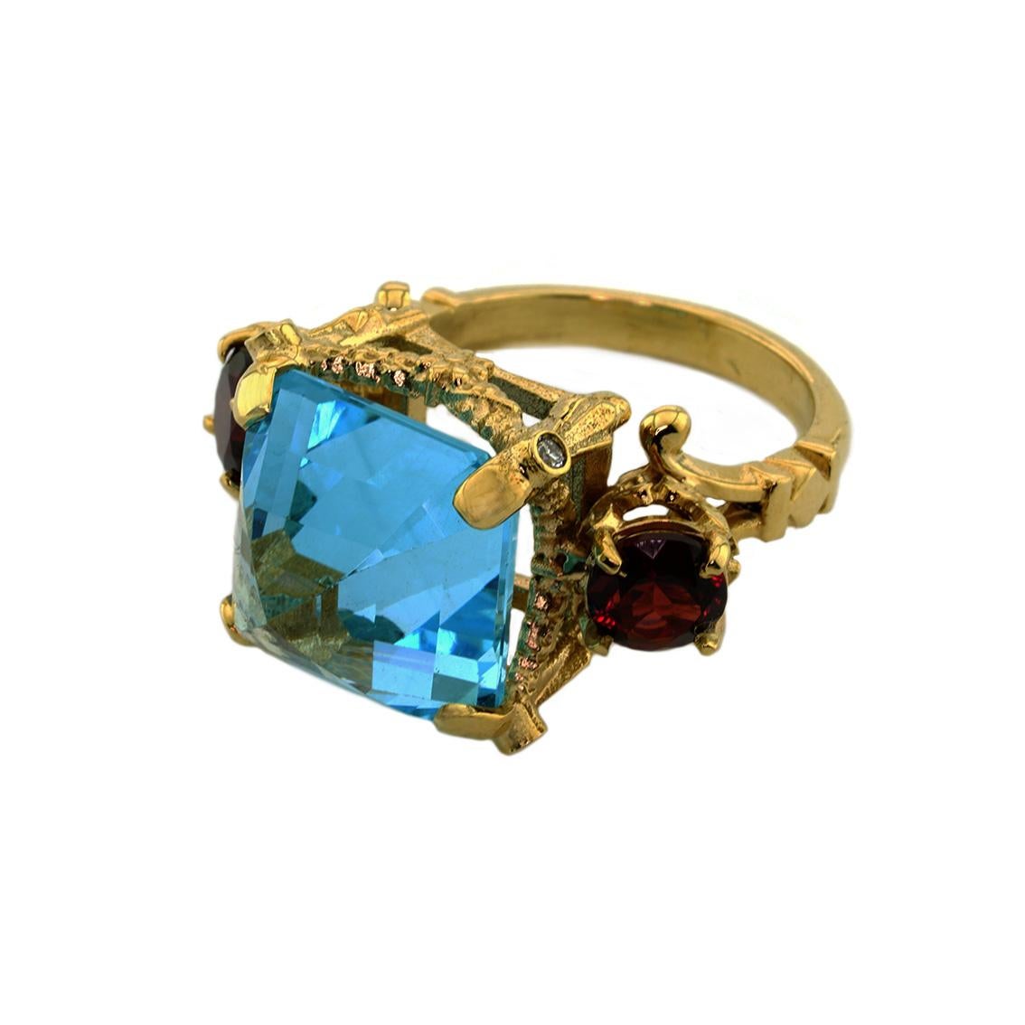 The Elysium Ring is an enchanting piece. 

Handmade from 9kt yellow gold this luxurious ring features a stunning, 14mm square topaz. 

The topaz sits regally in a signature William Llewellyn Griffiths garland setting and is adorned with two 6mm