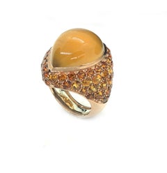 9 Karat Gold Cocktail Ring with Orange Citrine Pear Cabochon and Citrines Pavé