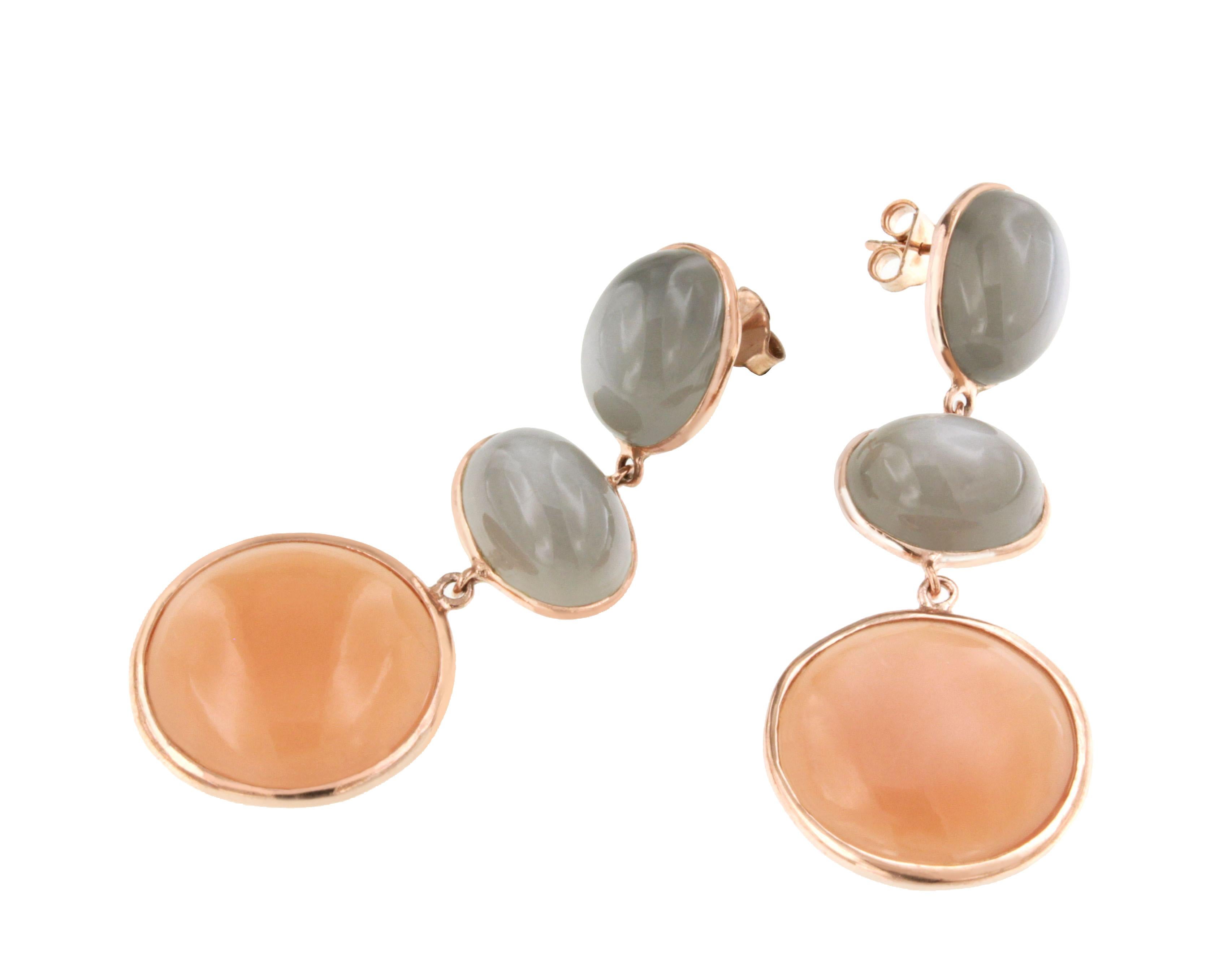 Earrings in rose gold 9 Karat with Grey Moonstone (oval cabochon cut, size: 10x14 mm) and Peach Moonstone (round cabochon cut, size: 20 mm)

All Stanoppi Jewelry is new and has never been previously owned or worn. Each item will arrive at your door