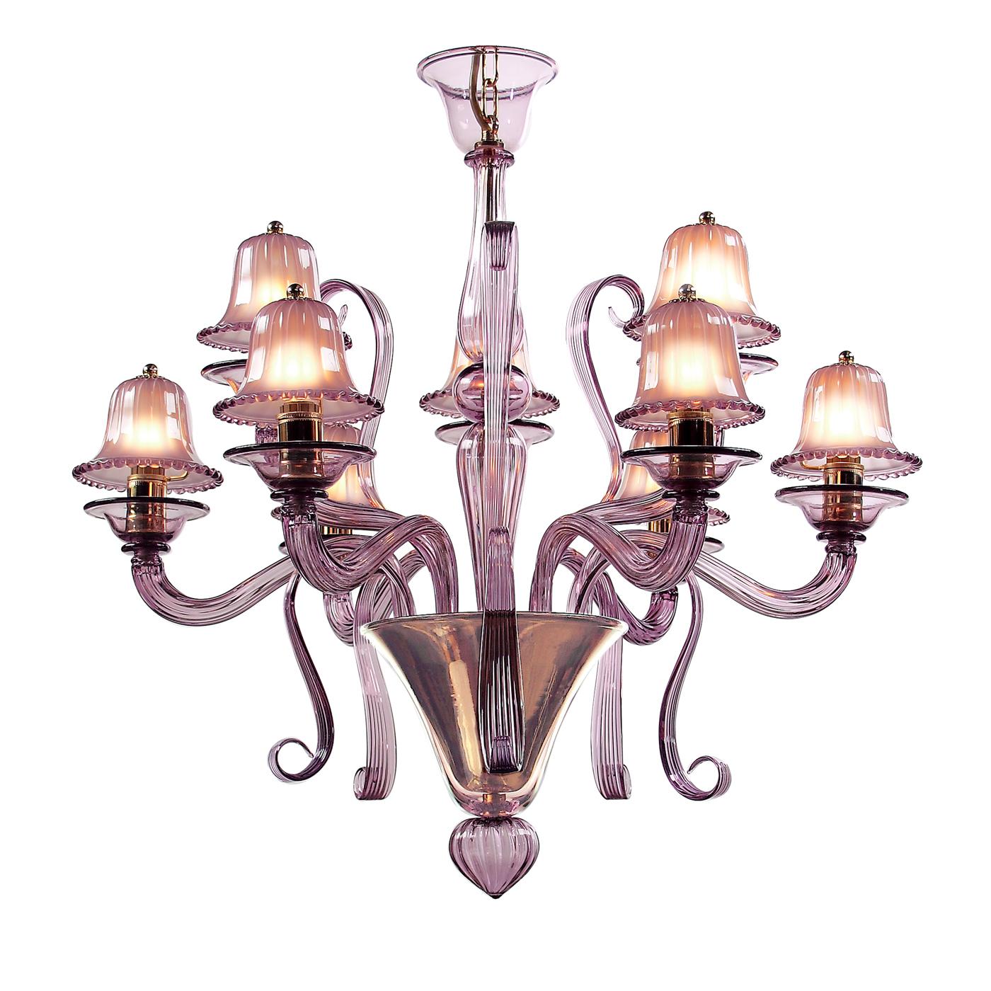 An innovative and attractive design for a unique piece of furniture: this 9-light chandelier is made of glass in pink shades and expertly handmade. A fabulous chandelier with sinuous and elegant lines that will evenly diffuse light in the