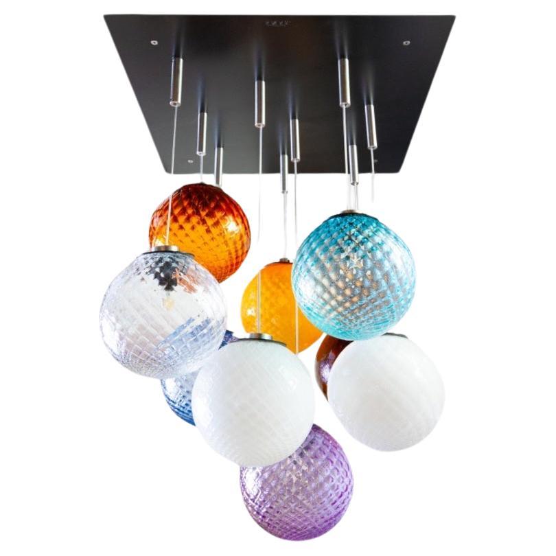 9 lights ceiling chandelier with colored transparent Murano glass spheres For Sale