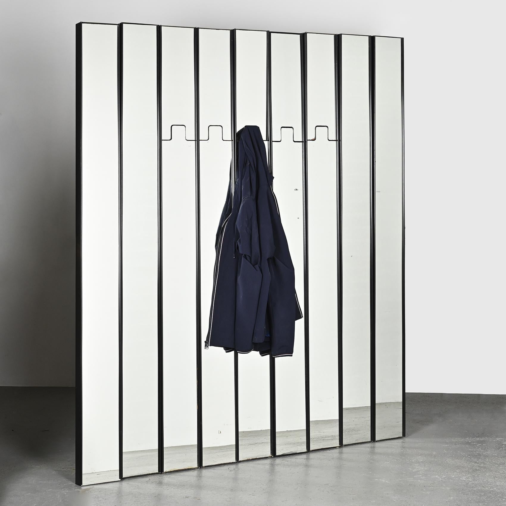 Set of nine elements from the Gronda collection, designed by Luciano BERTONCINI in the 1970s, consisting of 4 mirrors and 5 modular coat racks.

The structure of each element is made of black ABS plastic housing a mirror which, for the coat rack