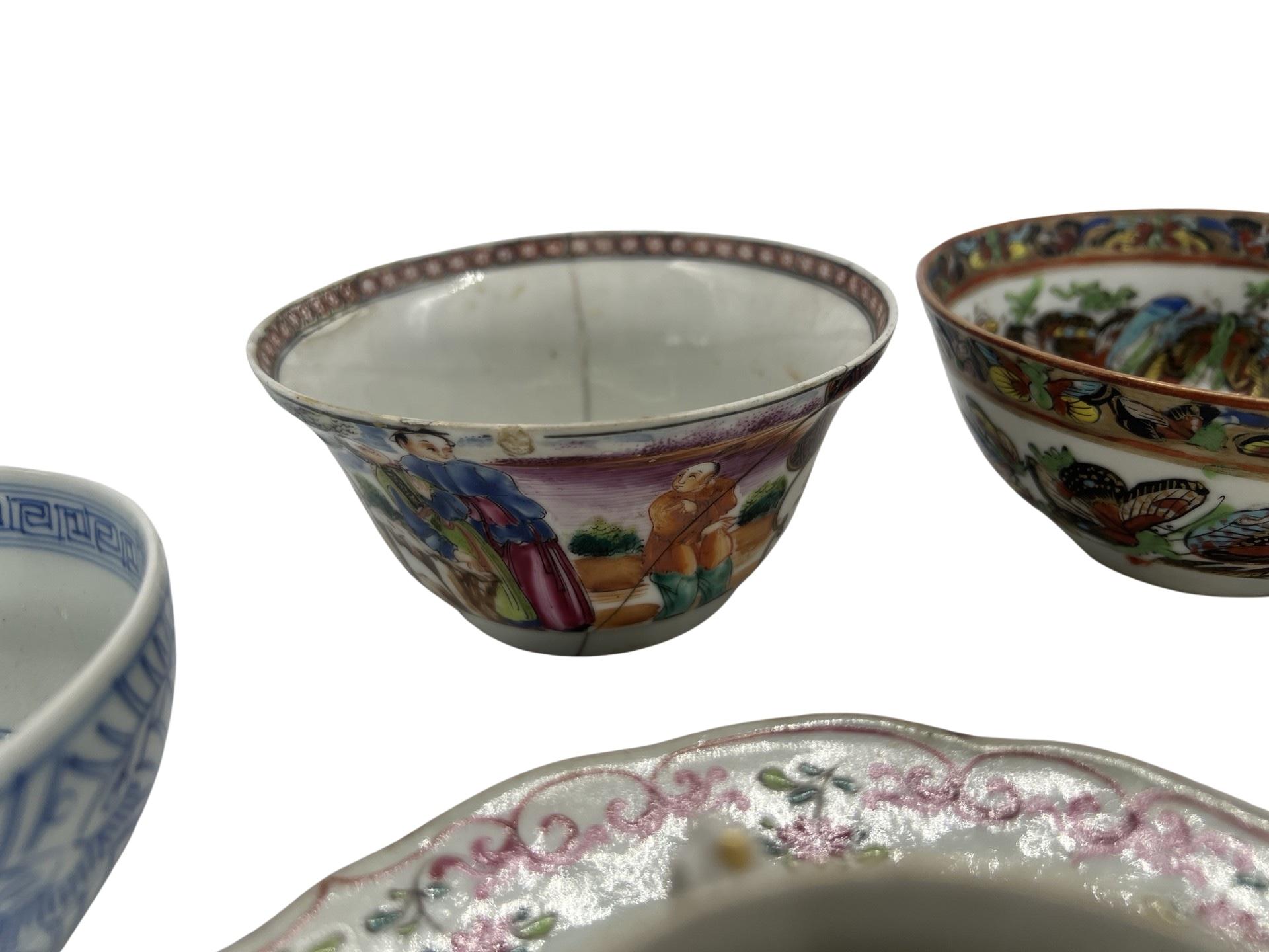 Chinese, mostly 18th century. 
<br>A grouping of 9 Chinese porcelain objects including a blue and white floral bowl, a Famille rose bowl heavily enamel decorated with figural scenes, a 