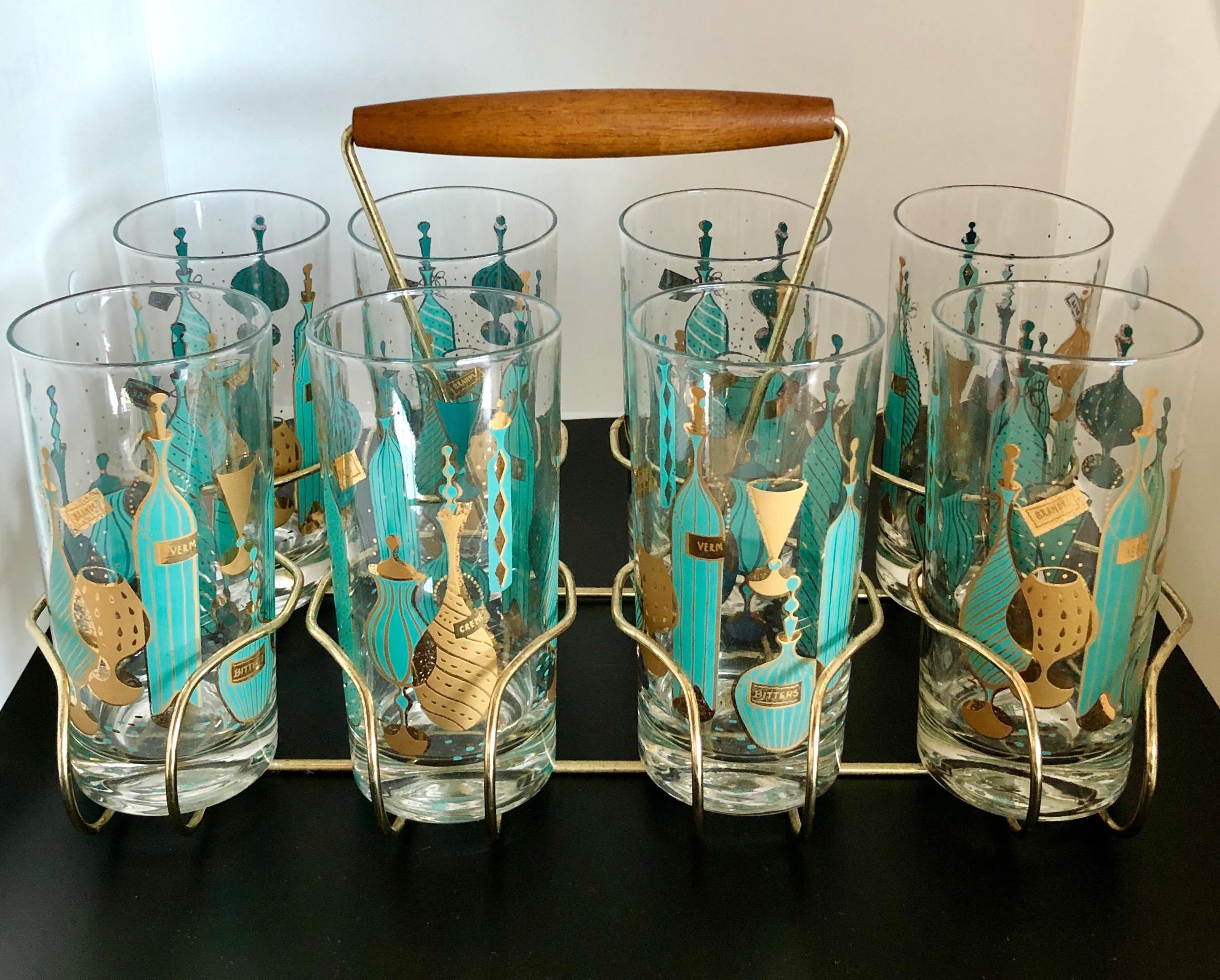 Offered is a nine-piece set of eight magnificent turquoise / aqua and gold Tom Collins cocktail glasses featuring exotic barware theme including bottles, decanters and cocktail glasses straight out of 