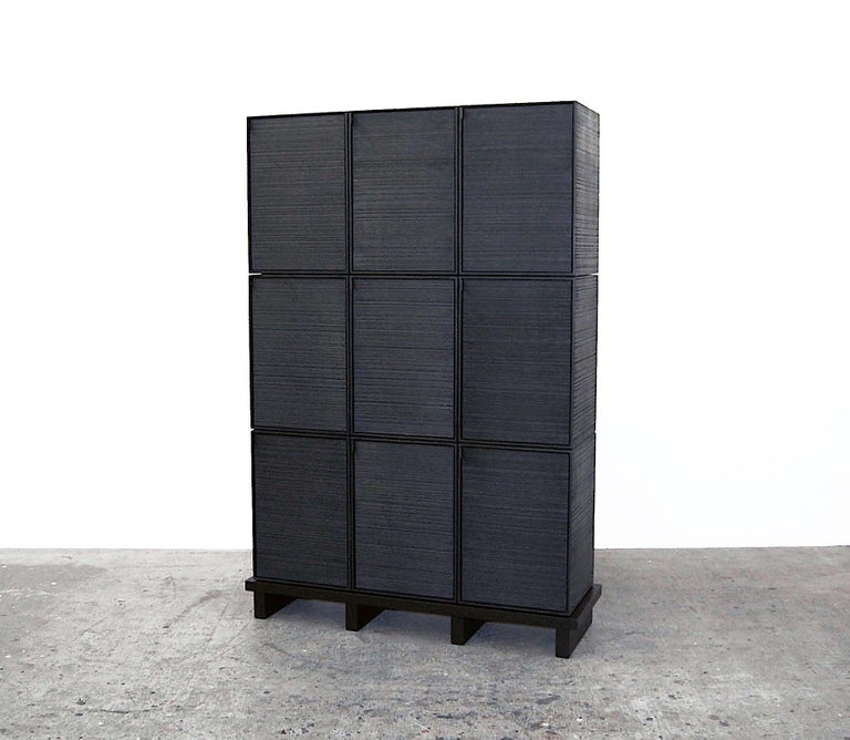 9 Rectangles cabinet by John Eric Byers
Dimensions: D115 x W38 x H165 cm
Materials: sawn + blackened + maple + ash

All works are individually handmade to order.

John Eric Byers creates geometrically inspired pieces that are minimal,