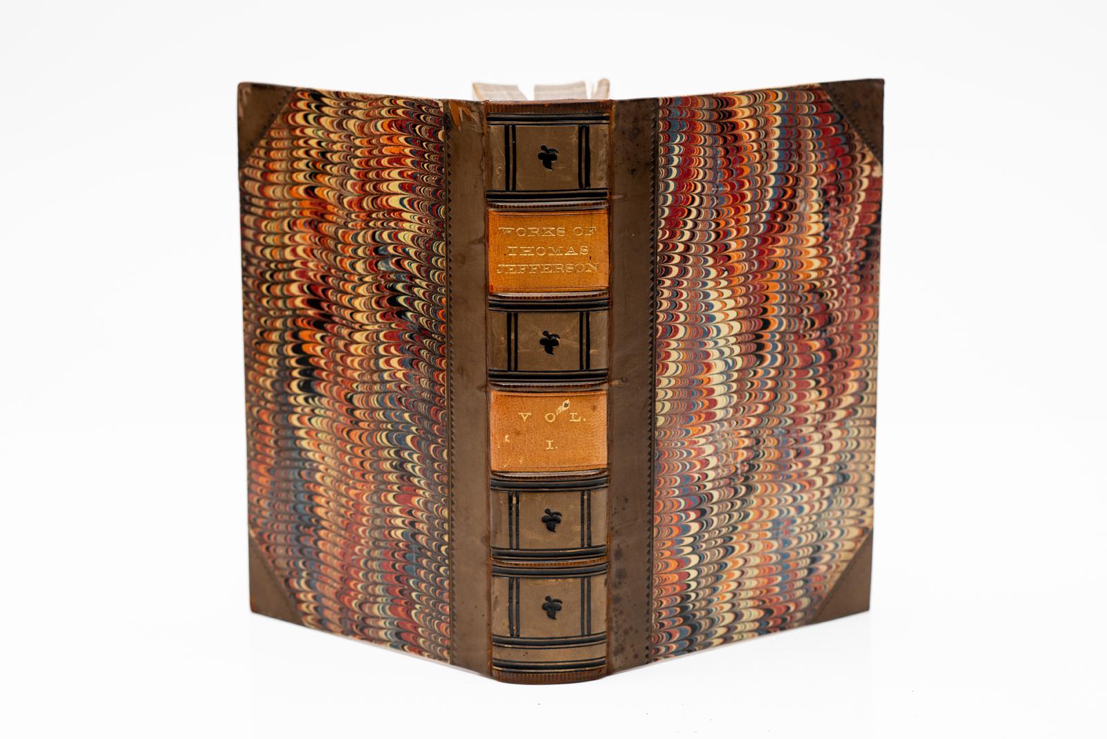 9 Volumes. Thomas Jefferson. The Writings.
Bound in 3/4 tan calf, marbled boards, edges,
endpapers, raised bands, labels, blind tooling,
illustrated. Published: New York: Derby & Jackson
1859. Handsome and Rare Set.
H: 9