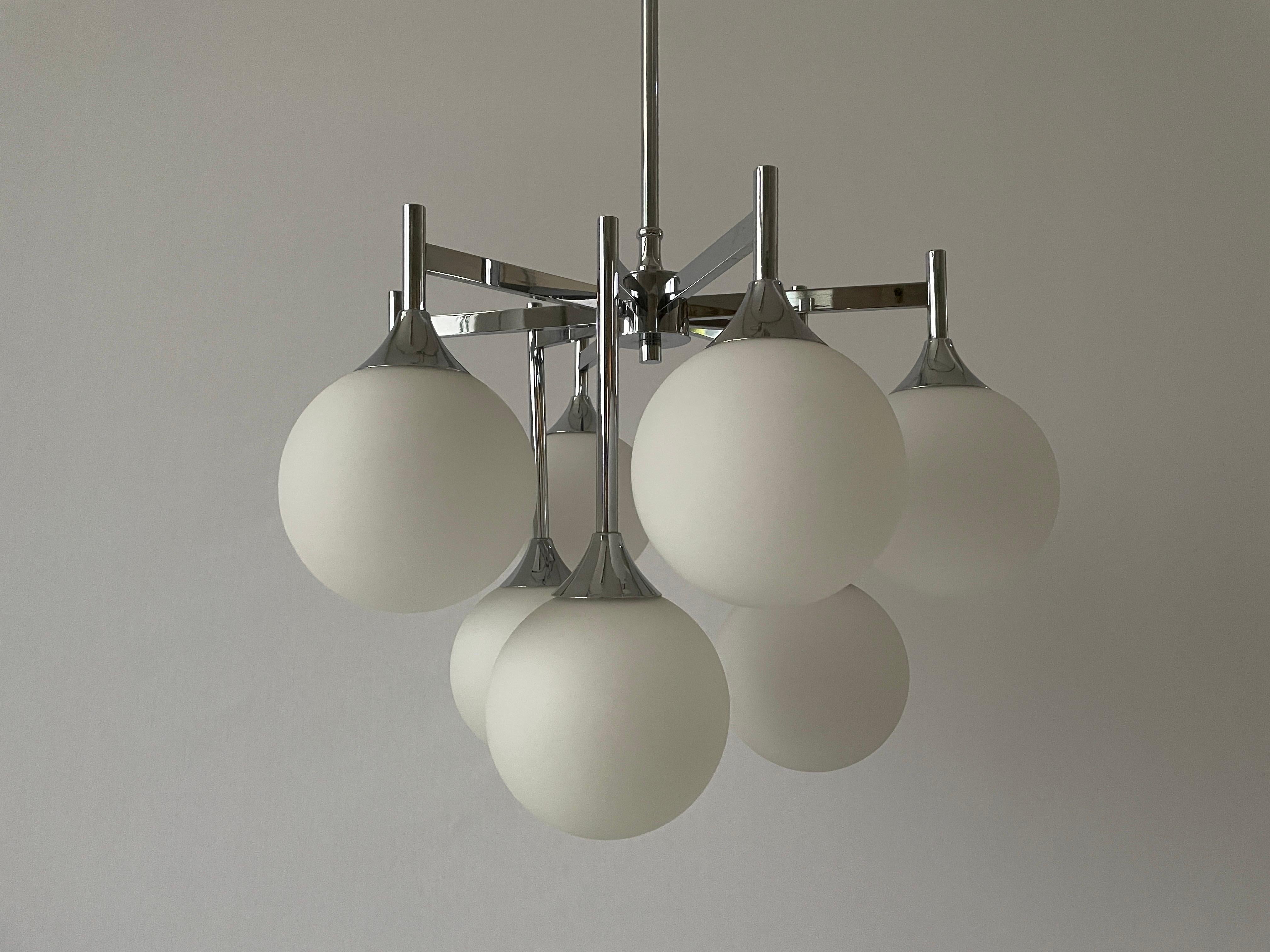 9 White Ball Glass and Chrome Body Chandelier by Kaiser Leuchten, 1960s, Germany

Fantastic pendant lamp

Lampshade is in good condition and very clean. 
This lamp works with 9 x E14 light bulb. 
Wired and suitable to use with 220V and 110V for all