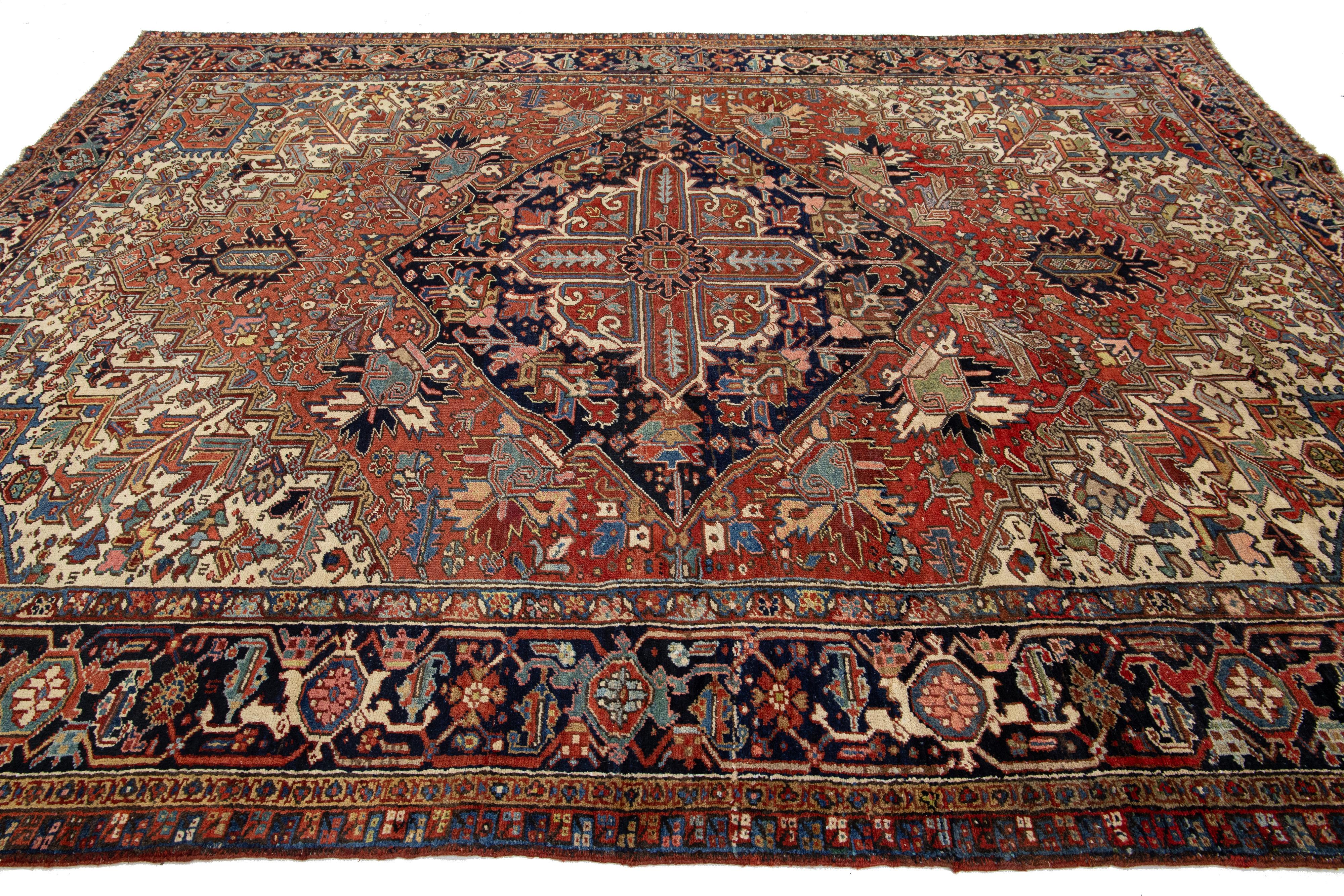 20th Century 9 x 12 Antique Persian Heriz Red Wool Rug With Medallion Design For Sale