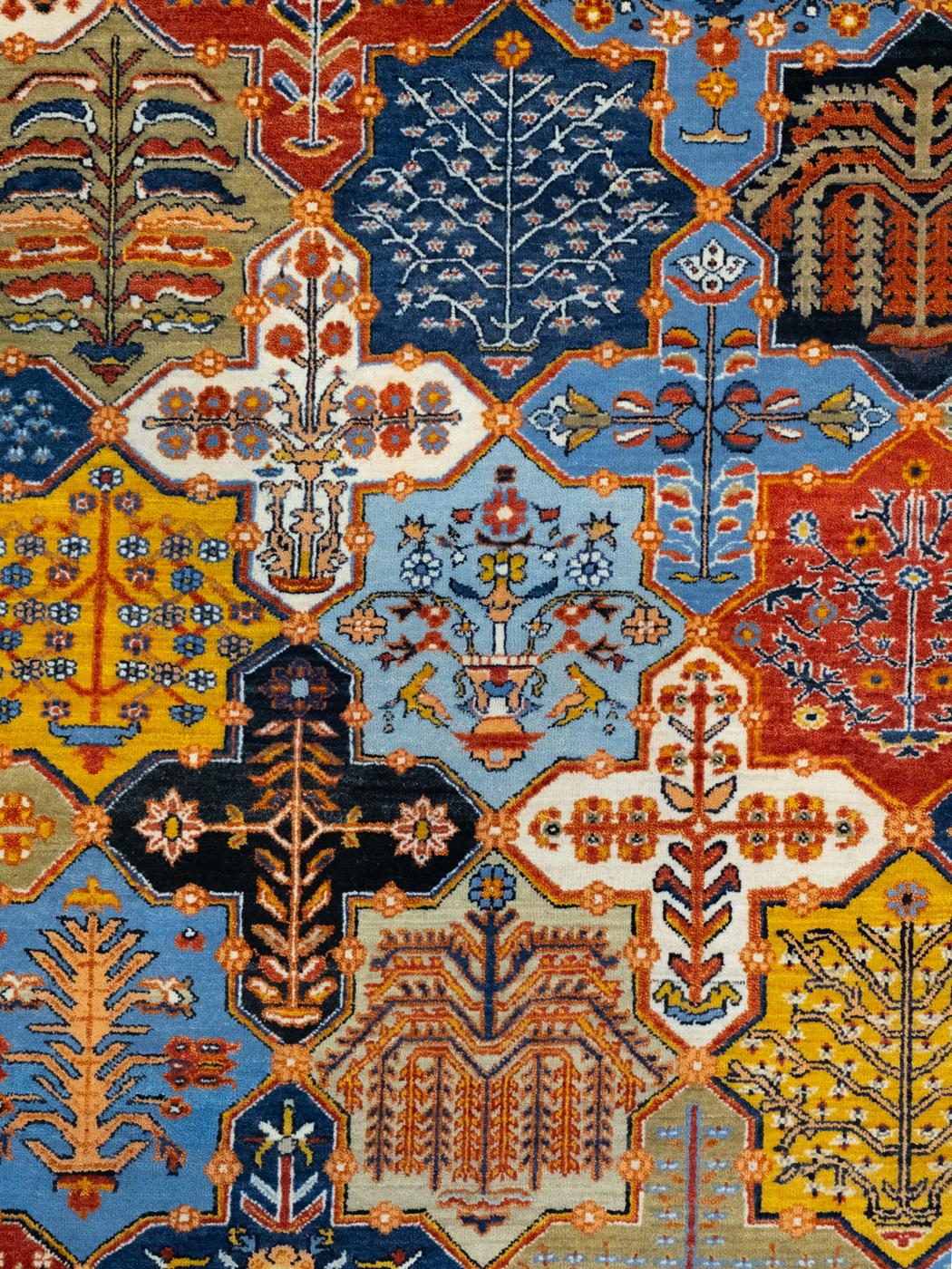 Elevate your space with the timeless allure of this 9' x 12' Bakhtiari Garden area rug hand-woven in blue, red, and yellow wool. Handknotted by artisans, this stunning masterpiece boasts a captivating blend of rich hues, derived from vegetable