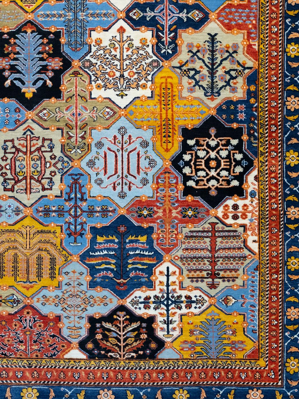Contemporary 9' x 12' Bakhtiari Garden Rug, Hand-Woven in Blue, Red, and Yellow Wool For Sale
