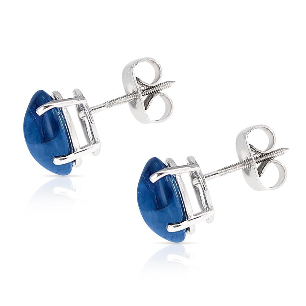 A pair of 9 x 7 MM Blue Sapphire Oval Cabochon Stud Earrings made in 14 Karat White Gold. The total stone weight is 5.33 carats.