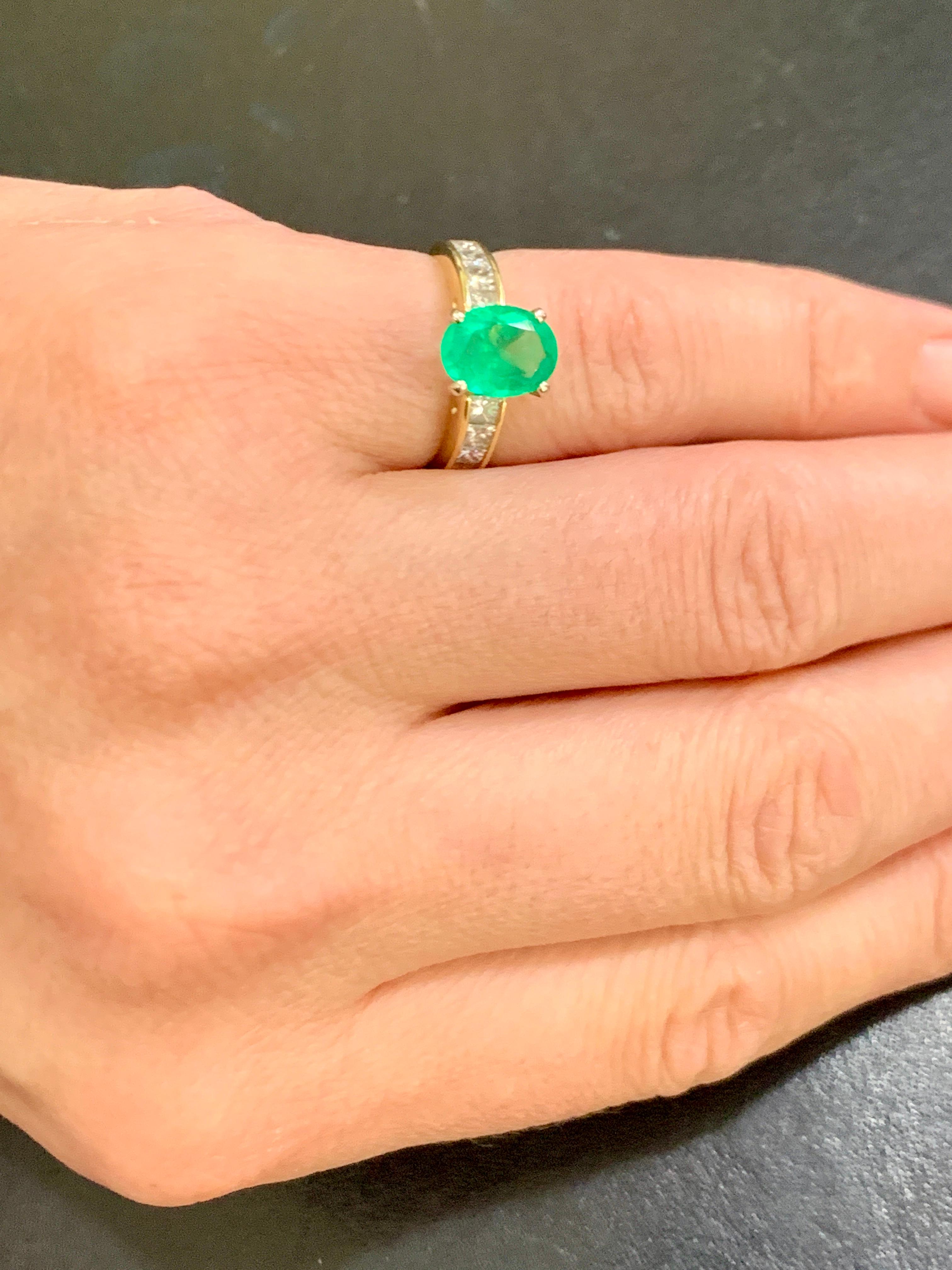 oval emerald ring with diamonds in yellow gold