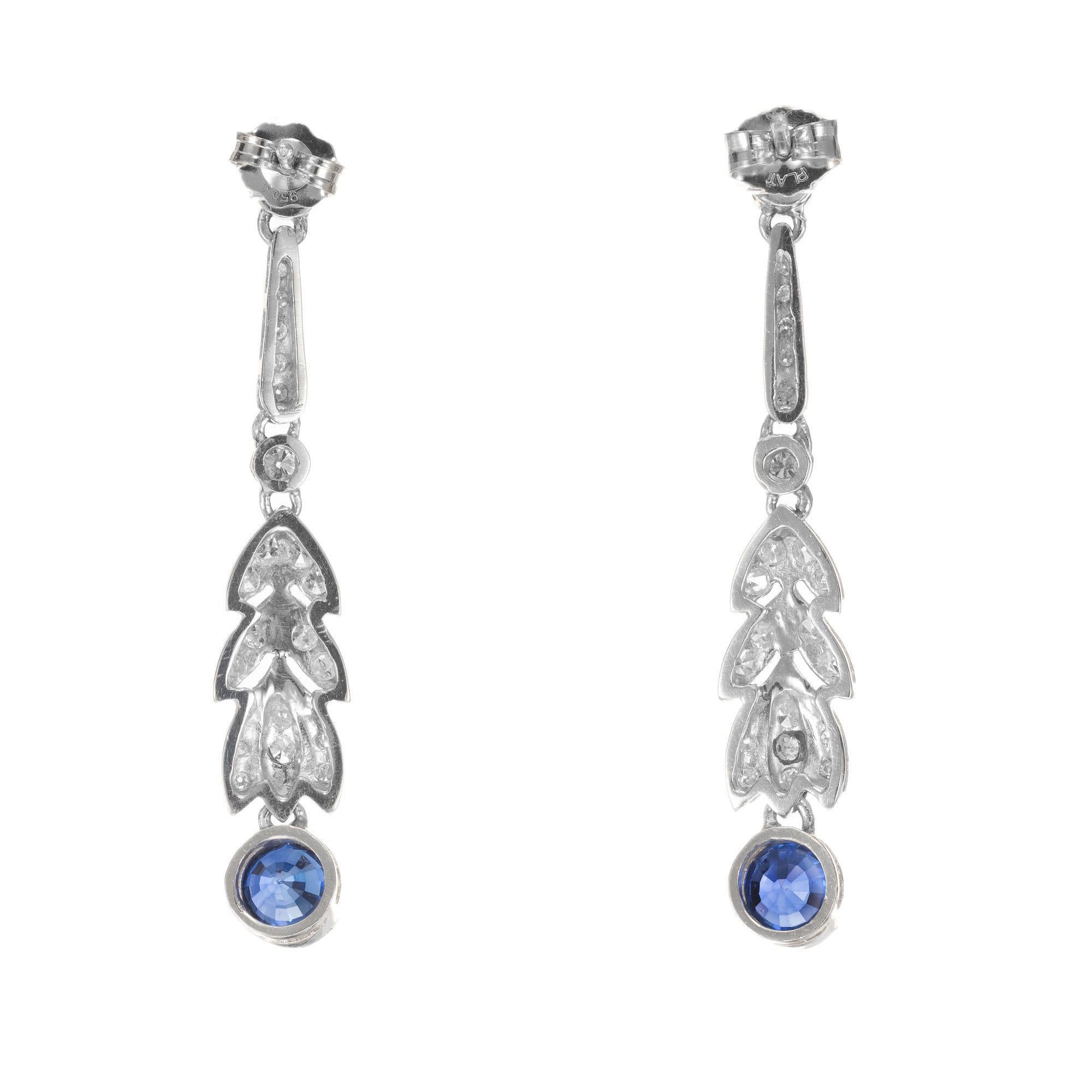 Art Deco 1920's sapphire and diamond earrings. 4 round brilliant cut diamonds with 40 singe cut accent diamonds. 2 round royal blue simple heat only sapphire dangles. Set in platinum.

2 round royal blue sapphires, VS-SI approx. .90cts
4 round