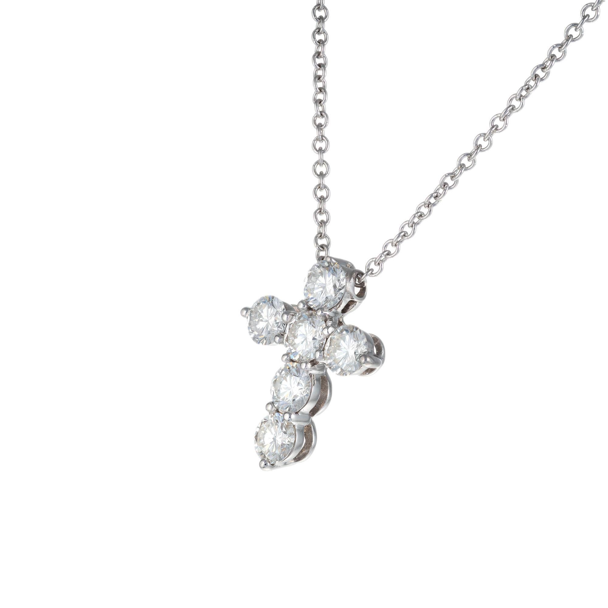 .90ct 6 round brilliant cut diamond cross pendant necklace, set in 18k white gold with a 16 inch 18k white gold chain. 

6 round brilliant cut diamonds G-H, SI approx. .90cts
18k white gold 
Stamped: 18k
3.4 grams
Top to bottom: 15.5mm or 5/8
