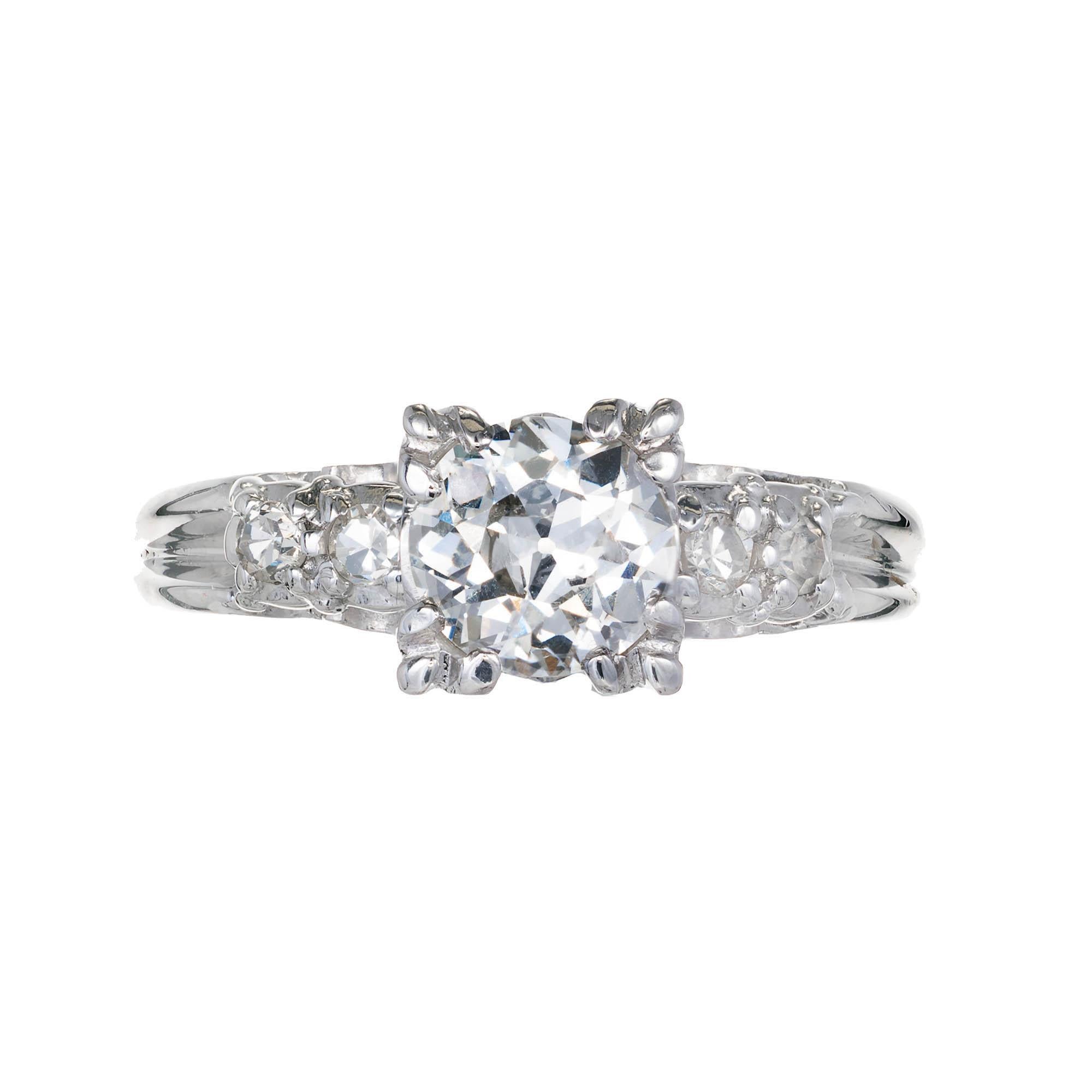 .90ct diamond Platinum antique style engagement ring. Old European cut diamond set in a triple prong at each corner of setting, for a square look with two accent diamonds set on either side with designed under gallery

1 Old European cut F-G SI