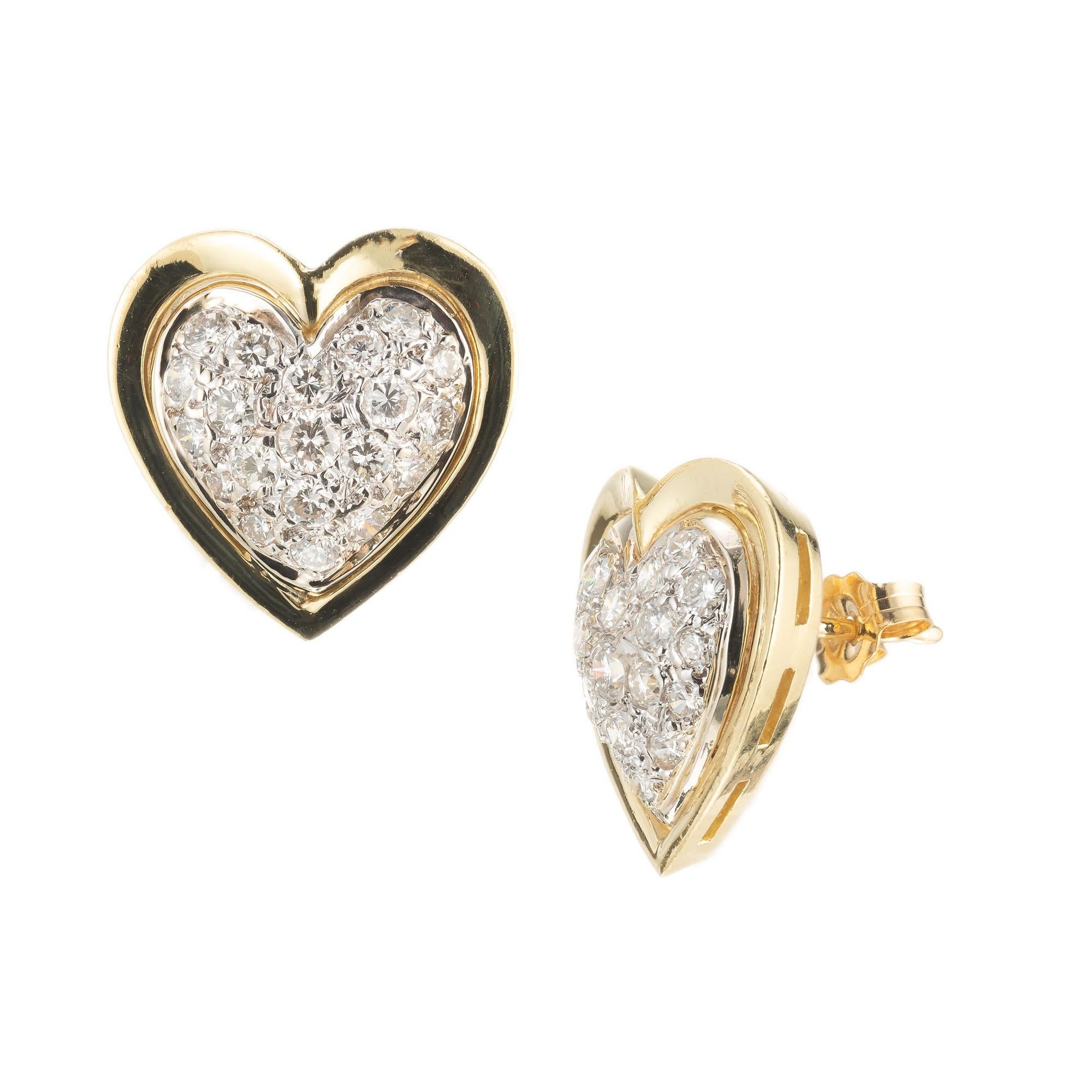 1960's Diamond heart earrings in 18k yellow and white gold. 40 round brilliant cut pave set diamonds.

40 round brilliant cut diamonds, G VS approx. .90cts
18k yellow gold 
18k white gold 
Stamped: 18k
Top to bottom: 15.6mm or 5/8 Inch
Width: 15.4mm