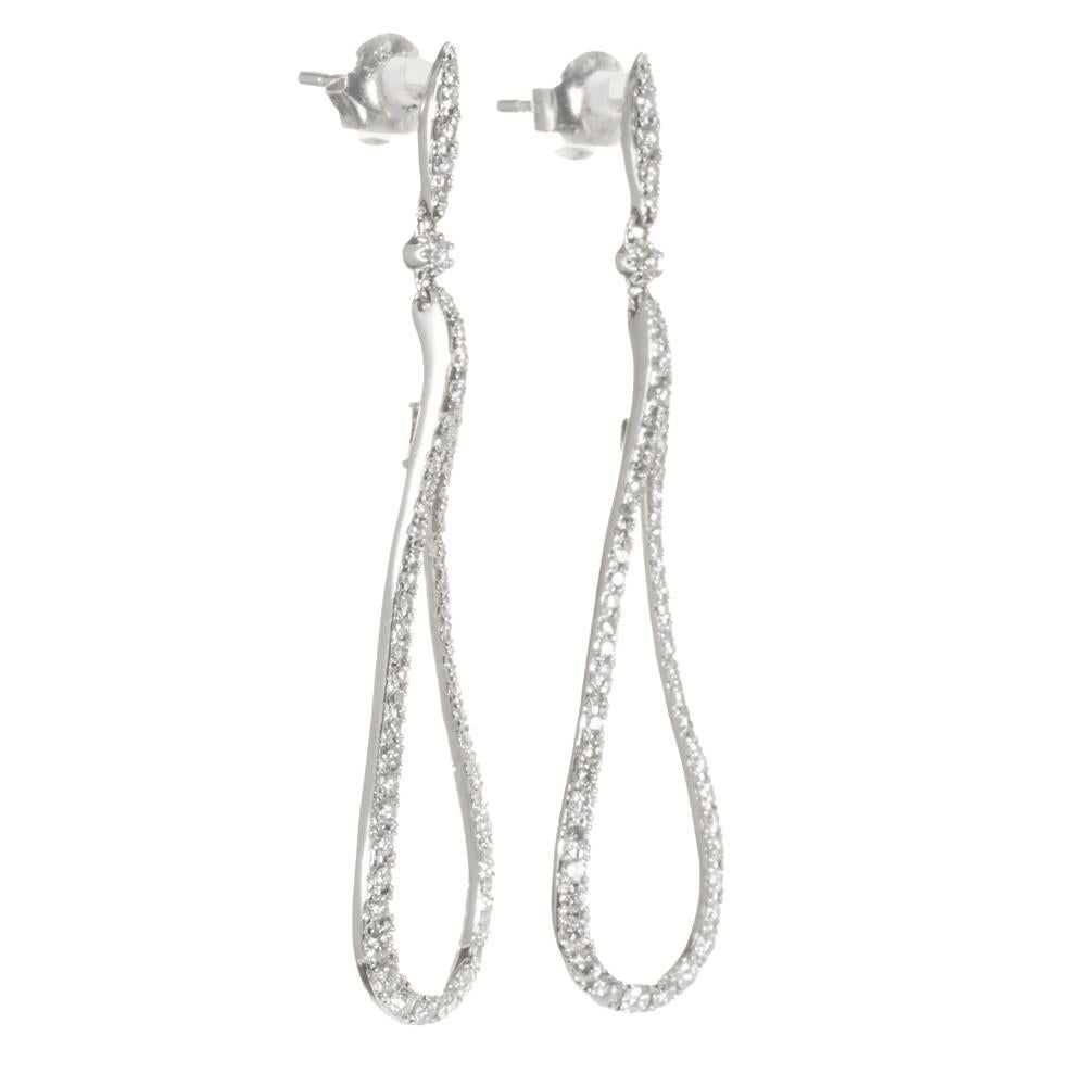 Elegant Loop shaped dangle diamond earrings. Comprised of 16 single cut diamonds totaling .90cts, set in 14k white gold loop style settings. 1.8 inches long diamond dangle drop earrings. Follow us on our 1stdibs storefront to view our weekly new