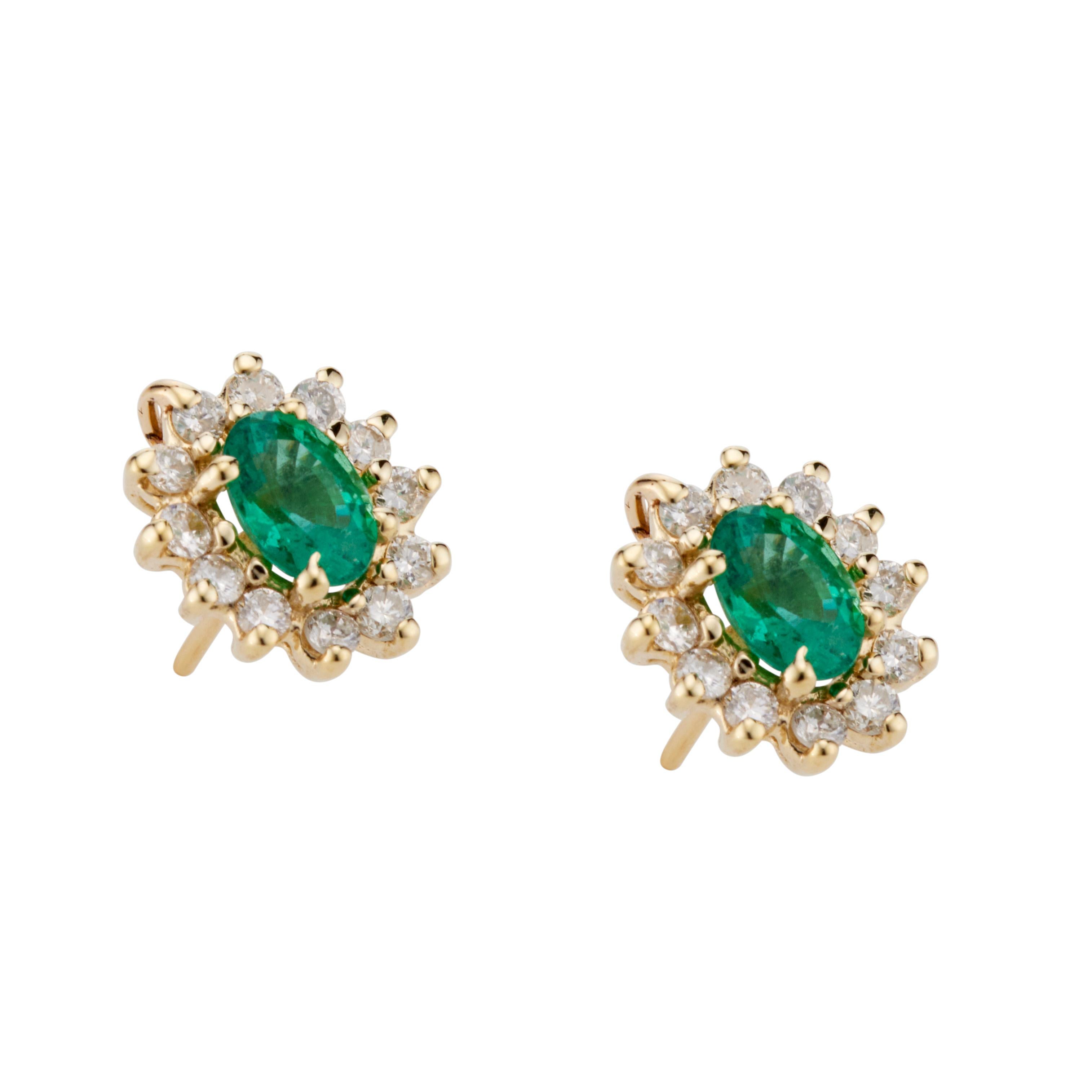 Bright green oval emerald earrings with a halo of full cut diamonds around each emeralds,  in 14k yellow gold baskets. 

2 oval green emeralds, MI approx. .90cts
24 round brilliant cut diamonds, I SI-I approx. .33cts
14k yellow gold 
Stamped: