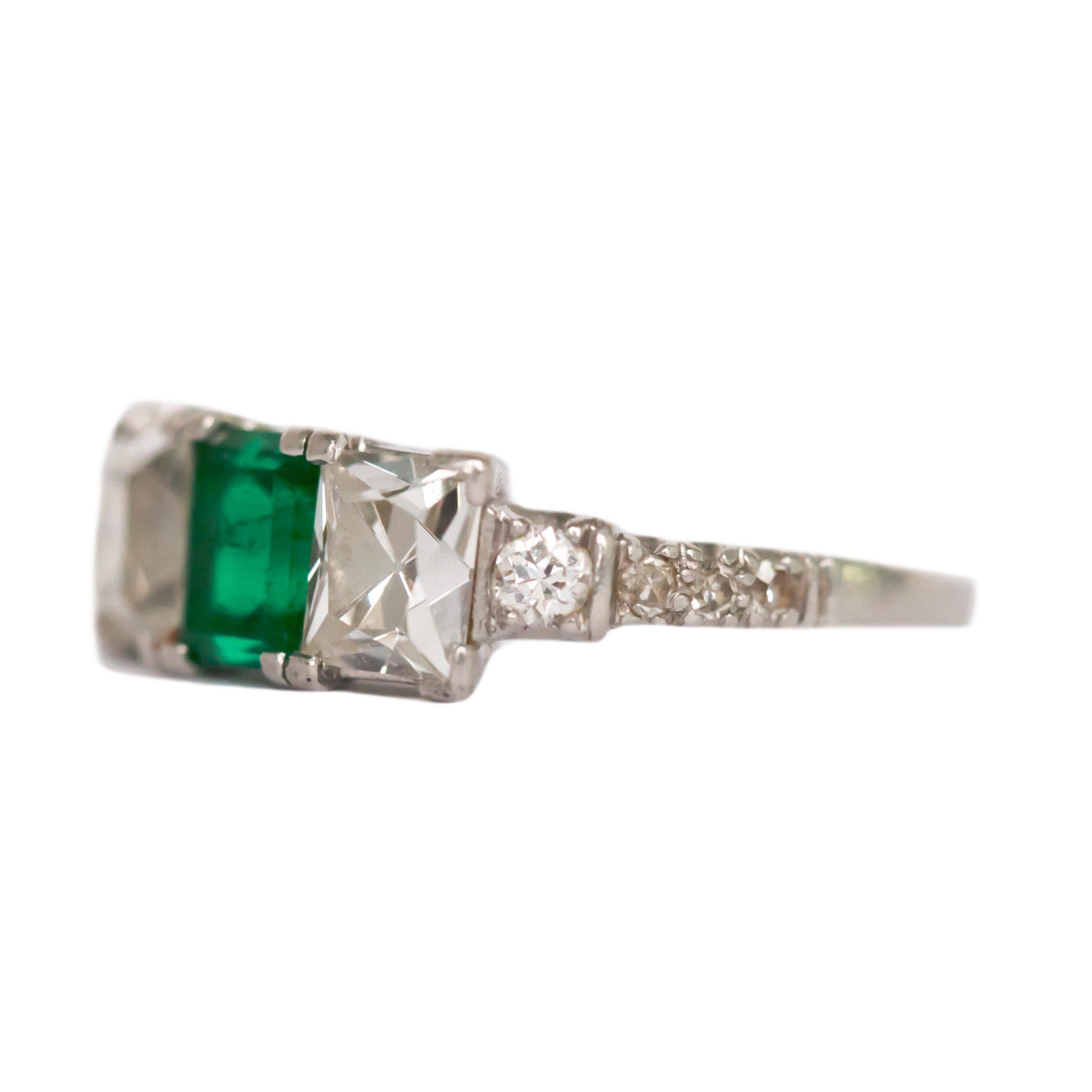 Ring Size: 6.75
Metal Type: Platinum  [Hallmarked, and Tested]
Weight: 4.5  grams

Center Stone Details:
Type: Emerald, Natural, Colombian 
Weight: .90 carat
Cut: Emerald
Color: Green 

2 Peruzzi Cut Side Diamond Details:
Weight: 1.70 carat, total