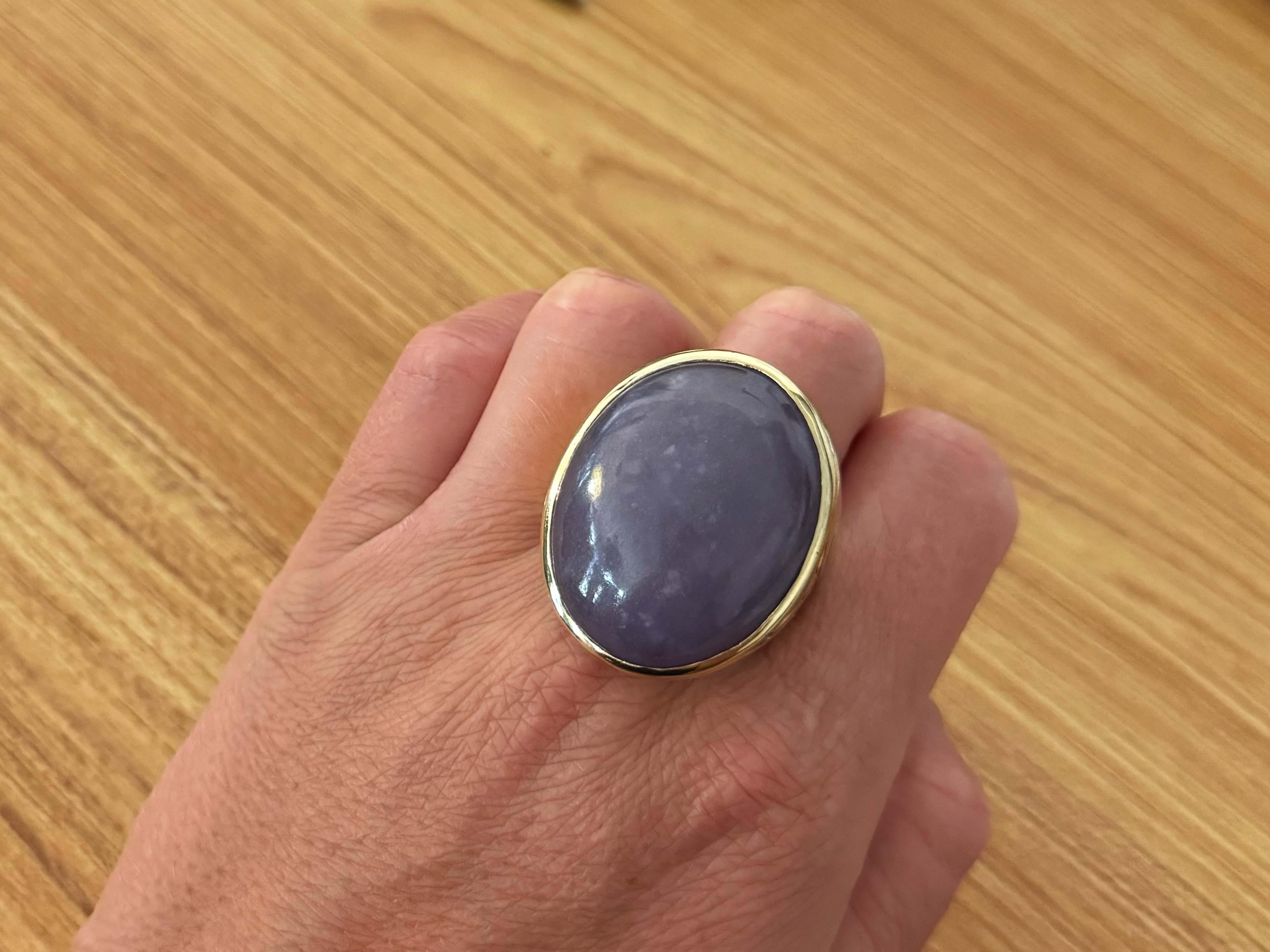 Ring Specifications:

Metal: 14k Yellow Gold

Total Weight: 42.4 Grams
​
​Jade Measurements: 33 mm x 27 mm x 11.24 mm

Jade Carat Weight: ~90 carats

Ring Size: 14.5 (resizable)

Stamped: 