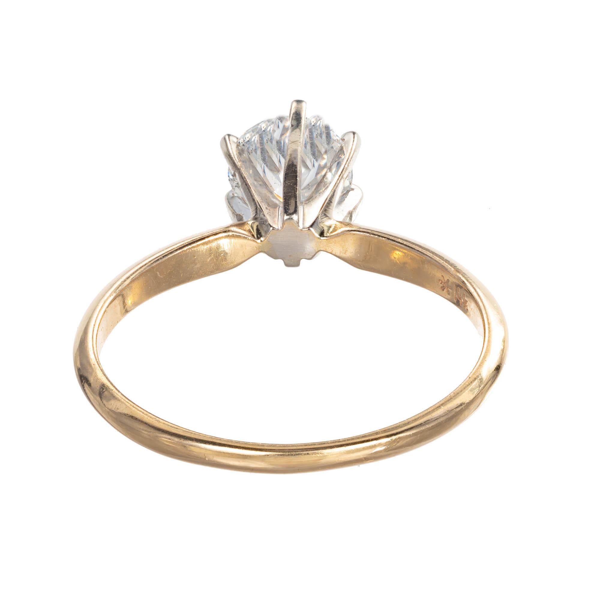 Diamond engagement solitaire engagement ring. round brilliant cut Diamond set in a 6 prong 14k white gold settings on a 14k yellow gold band.

1 round brilliant cut Diamond, approx. total weight .90cts, F – G, I1, 5.94 x 5.93 x 4.0mm, EGL