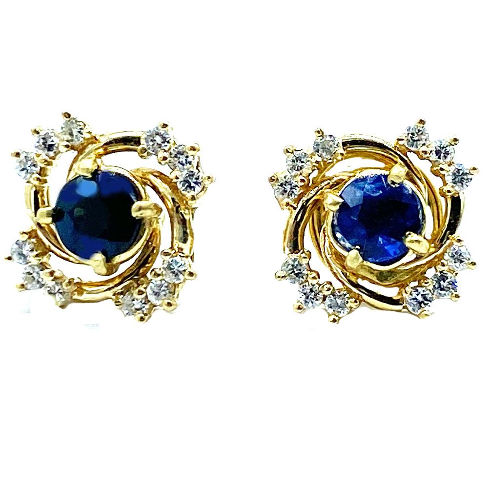Quality Diamond, sapphire stud earrings.
Solitaire center diamonds measure 4.40 mm and are .30 carats each with a total weight of .60 CTW.
 Each earring is adorned by (12) outside diamonds 1.40 mm each (total are .30 CT outside diamonds)

The total