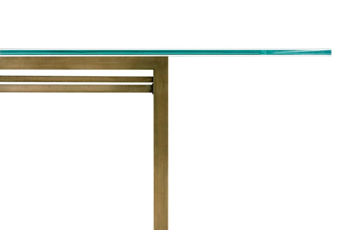 The 90° Glass & Metal Dining Table features a frame made of steel or brass angles and a rectangular glass top. 

Made to order and handcrafted in the USA. Frame available in a range of five metal finishes including stainless steel, patinated brass,