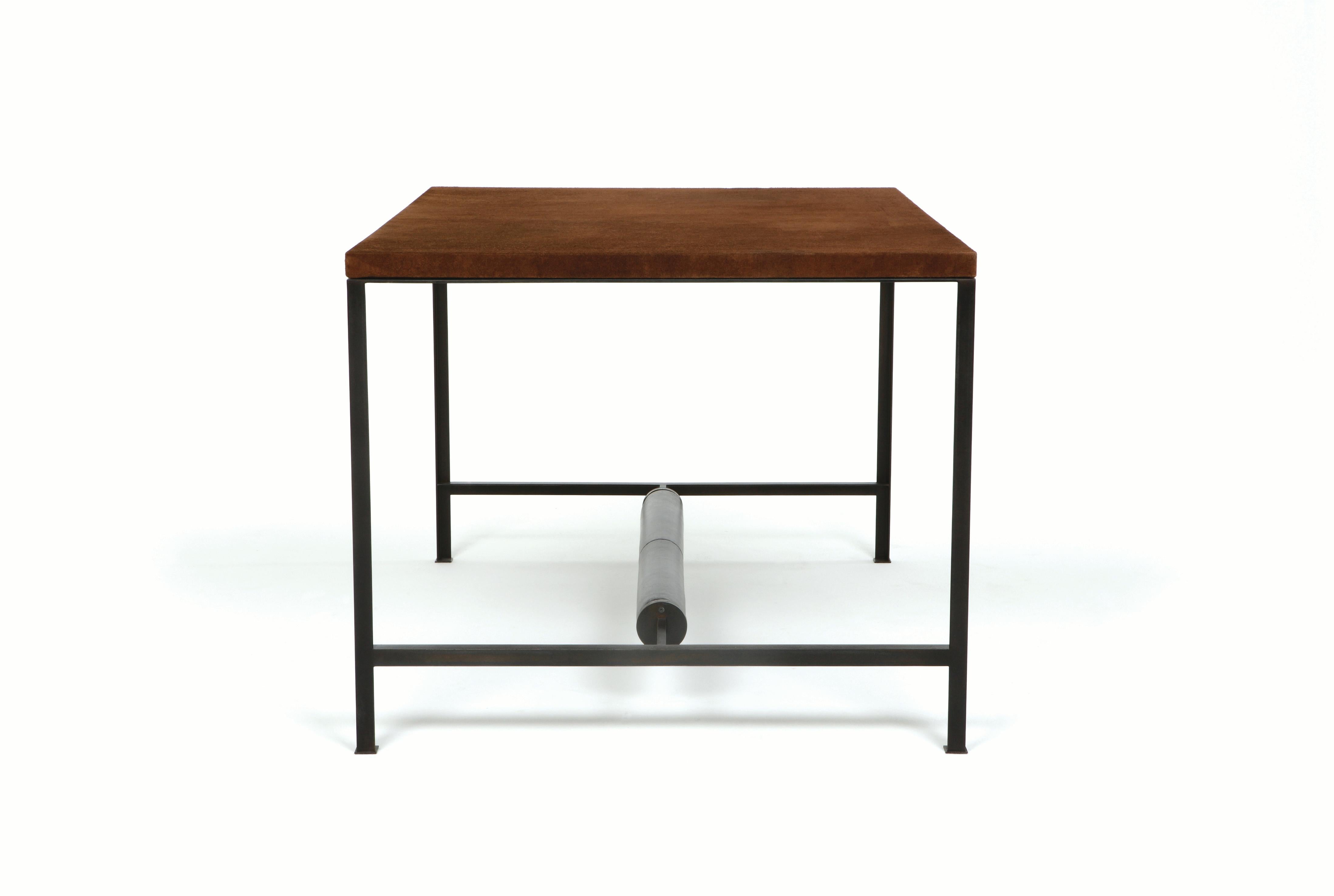 The 90° leather & metal writing desk features a frame made of 1” blackened steel angles and brown suede leather wrapped top with a black leather upholstered foot rest.

Made to order and handcrafted in the USA. Available in a range of five metal