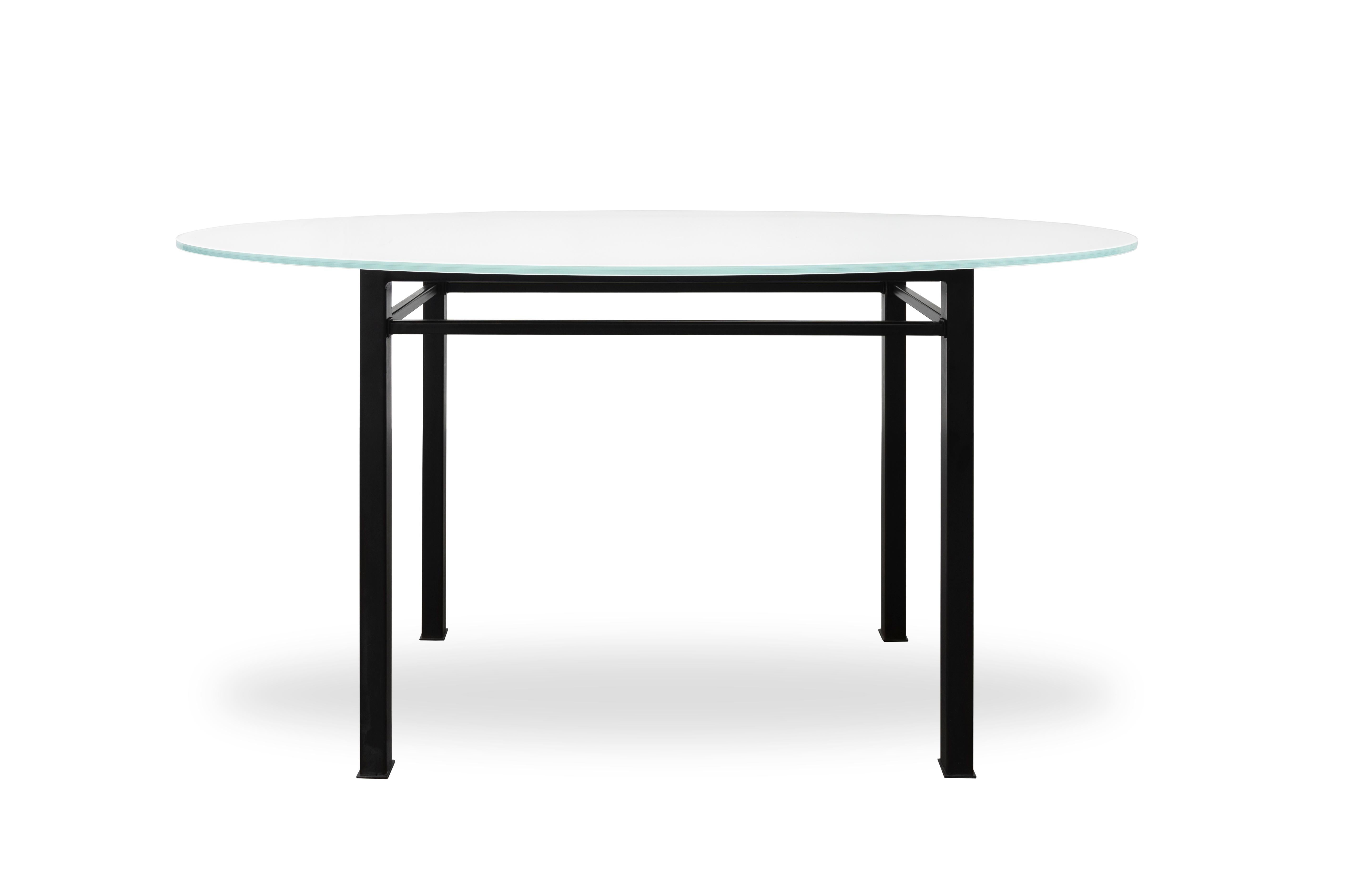 The 90° Glass & Metal Oval Dining Table features a frame made of blackened steel accented by a back-painted glass top in white. 

Handcrafted in the USA.