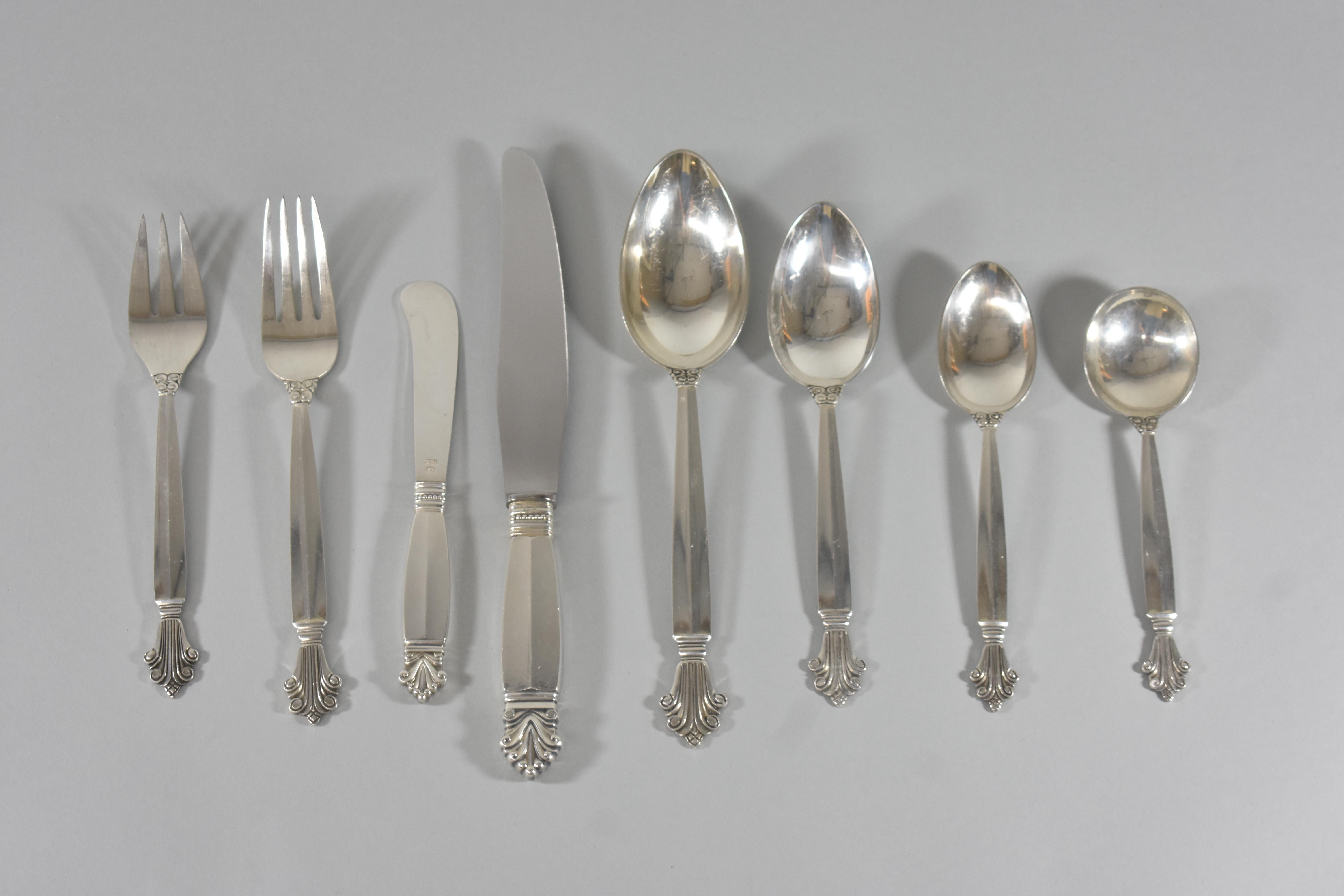 A beautiful 90 piece sterling silver flatware set by Georg Jensen in the Acanthus pattern. It contains the following pieces:
20 teaspoons 6