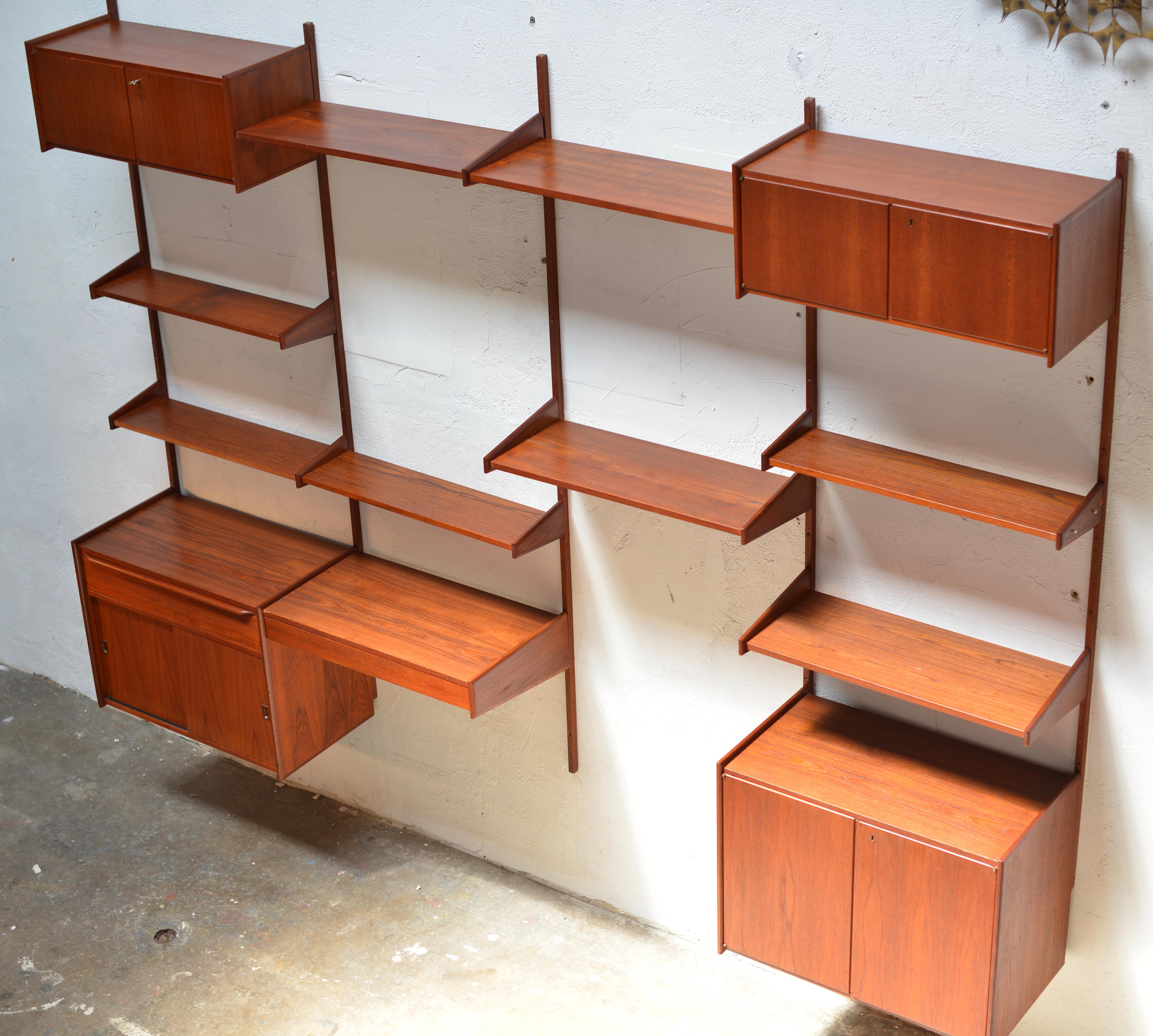 We have over 90 pieces of this is a great Scandinavian Modern wall unit made from beautifully selected teak veneer over solid wood. Current inventory includes over 10 solid teak wall panels (see last photo), 60 shelves, 4 cabinets, 1 doublewide