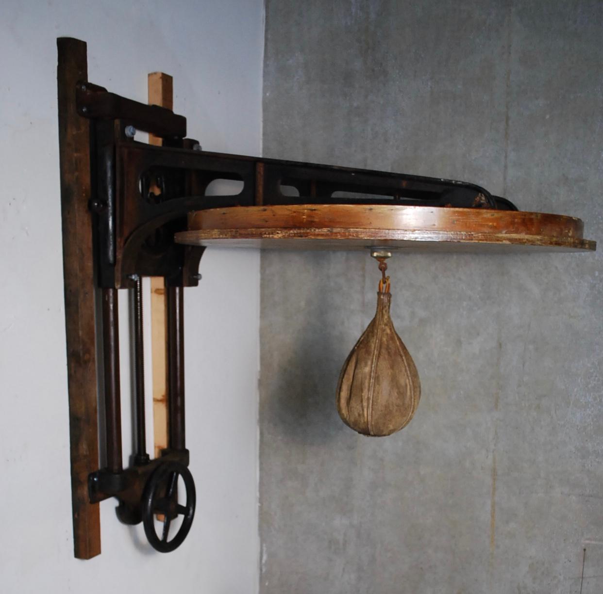 Exceptional rare fully functional speed bag in cast iron with adjustable heights and heavy cast components.
This unit is complete and has not been cleaned or touched. Original patina.
Made by the Narragansett Machine Company (