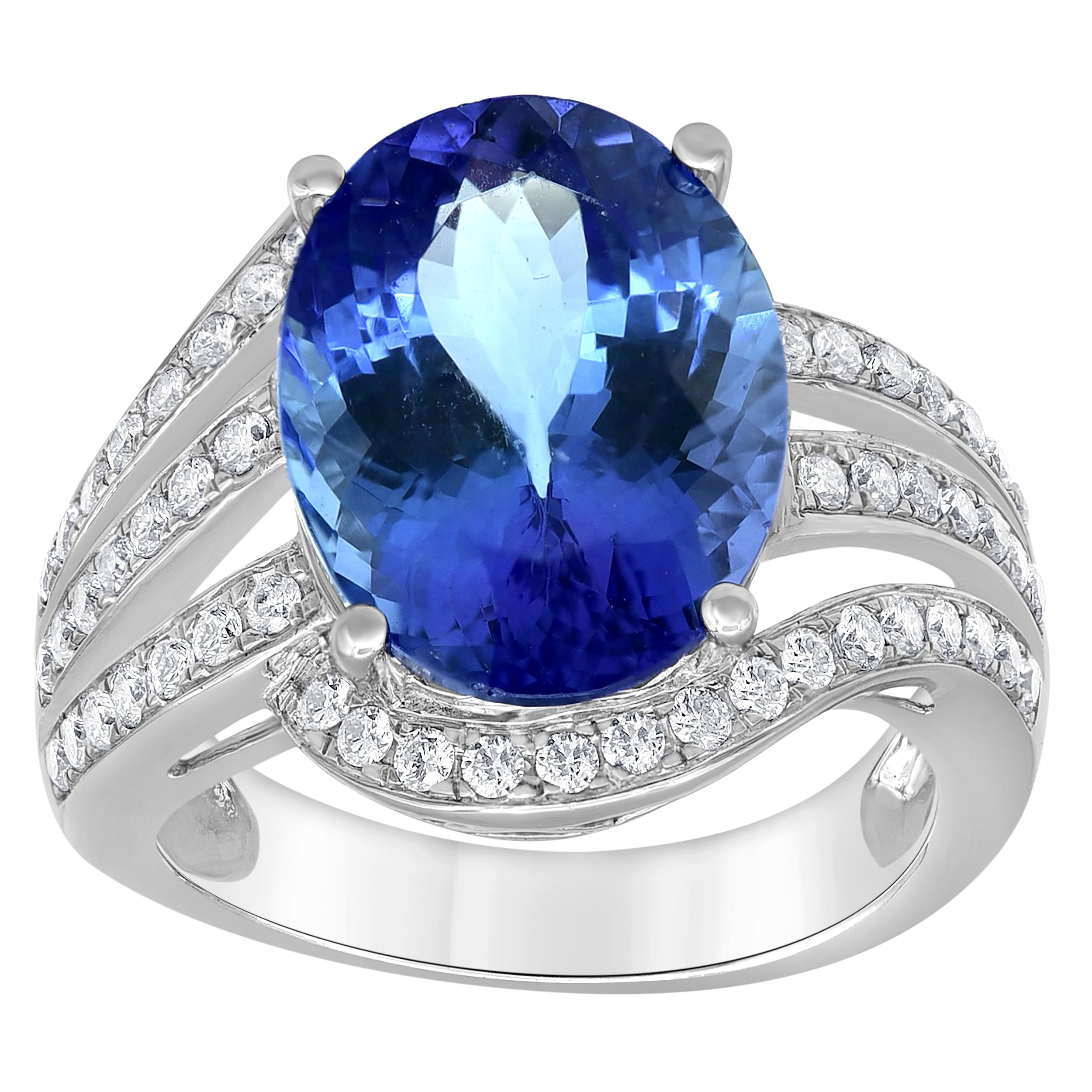 This ring features a gorgeous 8.30-carat oval-shaped Tanzanite. This Tanzanite stone has a stunning “peacock blue” color. The diamond-studded 58 diamond 0.65 carats each with a triple split shank gives this piece a glamorous look.