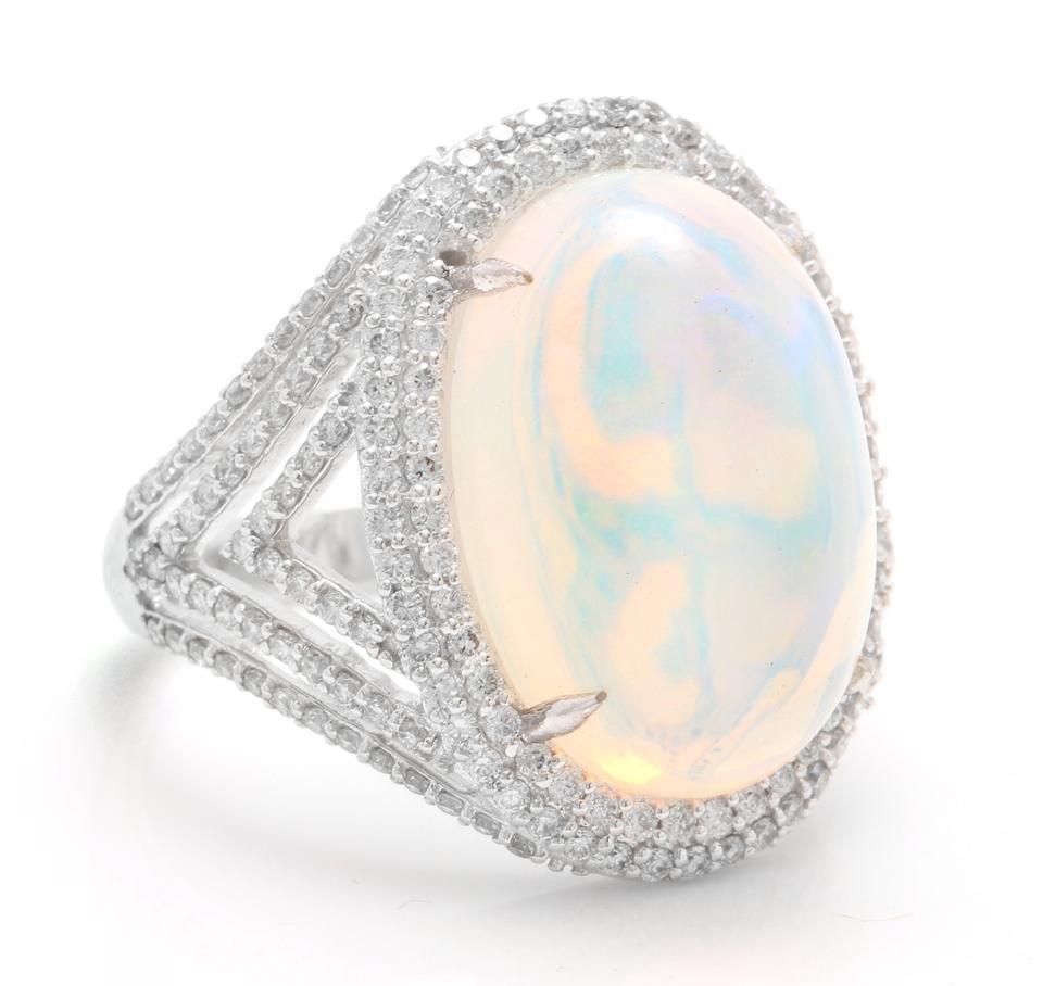 9.00 Carats Natural Impressive Ethiopian Opal and Diamond 14K Solid White Gold Ring

Total Natural Opal Weight is: Approx. 8.00 Carats

Opal Measures: 17.50 x 12.00mm

The head of the ring measures: 22.00 x 16.00mm

Total Natural Round Diamonds