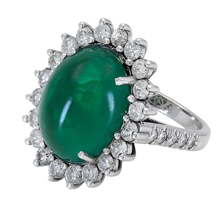 Contemporary 9.00 Carat Oval Cabochon Emerald and Diamond Flower Halo Cocktail Ring For Sale
