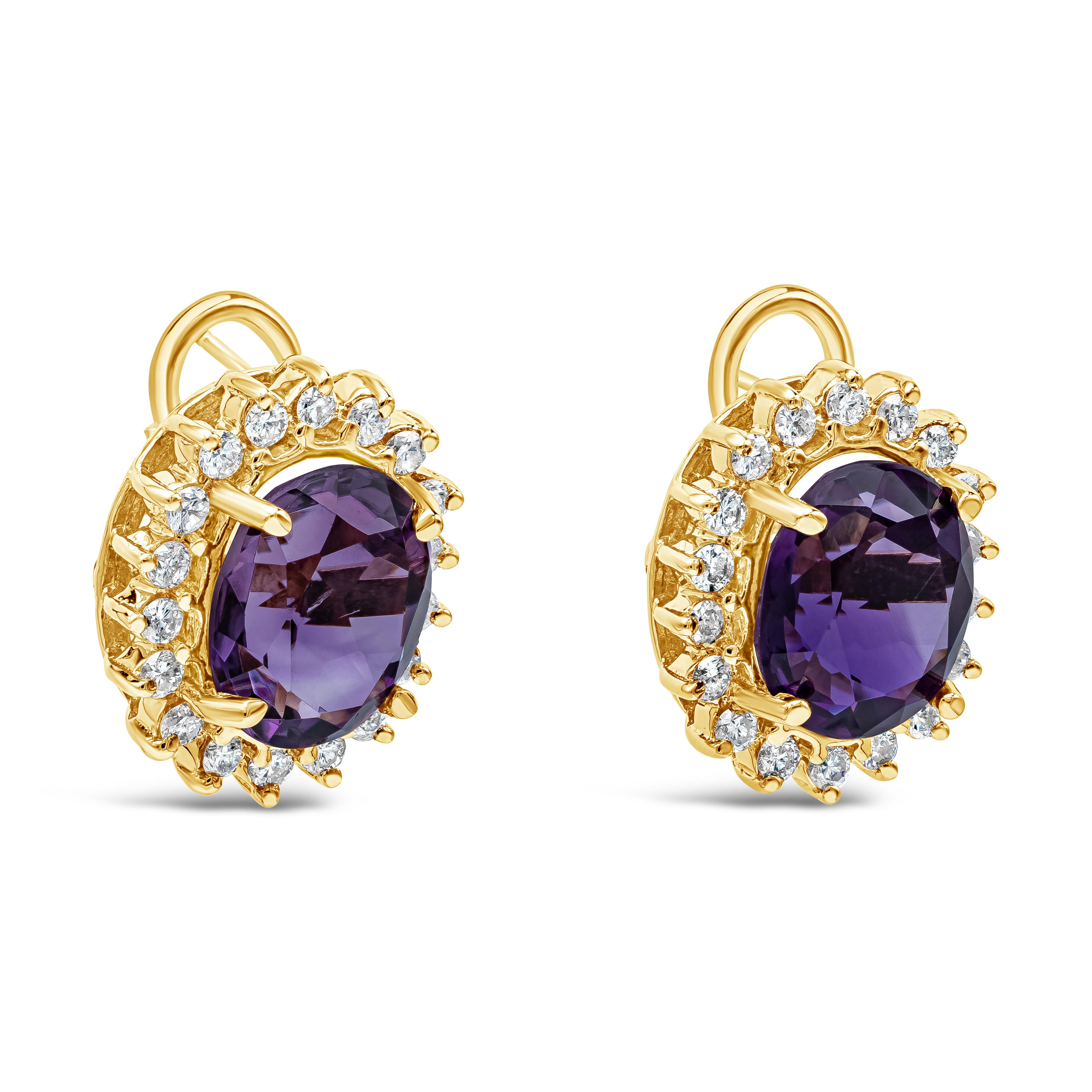 Features two color-rich oval cut amethysts weighing 9.00 carats total, set in a classic four prong basket setting and surrounded by a single row of round brilliant diamonds in a halo design. Diamonds weigh 1.45 carats total and are approximately G-H